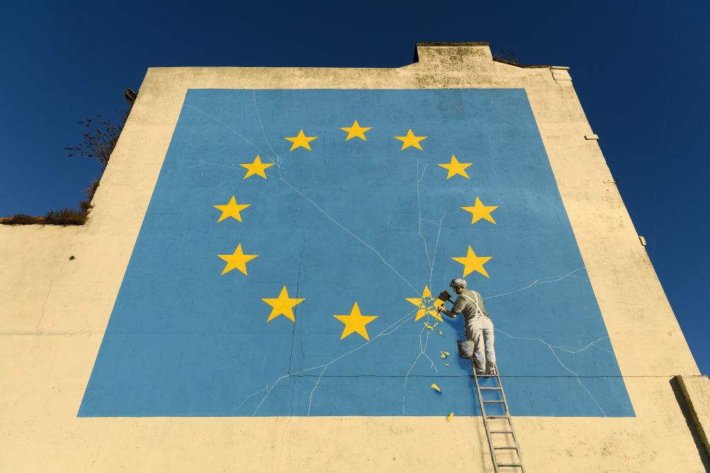A painting depicting a workman chipping away at a star on the E.U. flag by artist Banksy is seen in Dover, England, on Jan. 3, 2019. (Leon Neal—Getty Images)