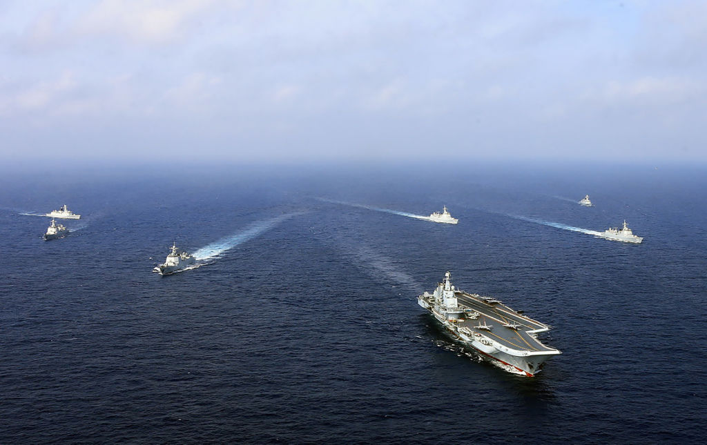 China's aircraft carrier the Liaoning (front), sails with other ships during a drill in April 2018. (AFP/Getty Images)