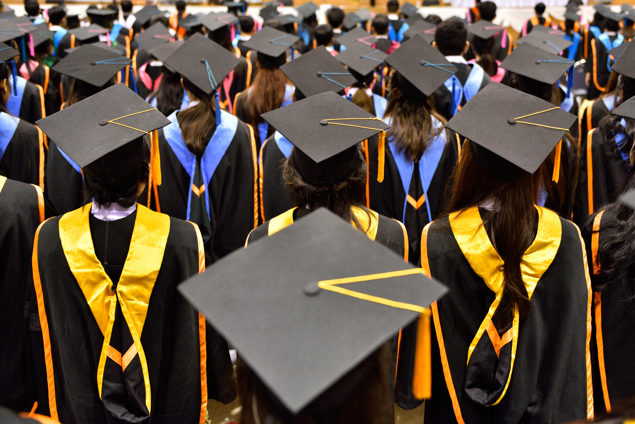 College students graduate in a commencement ceremony. (Getty Images)