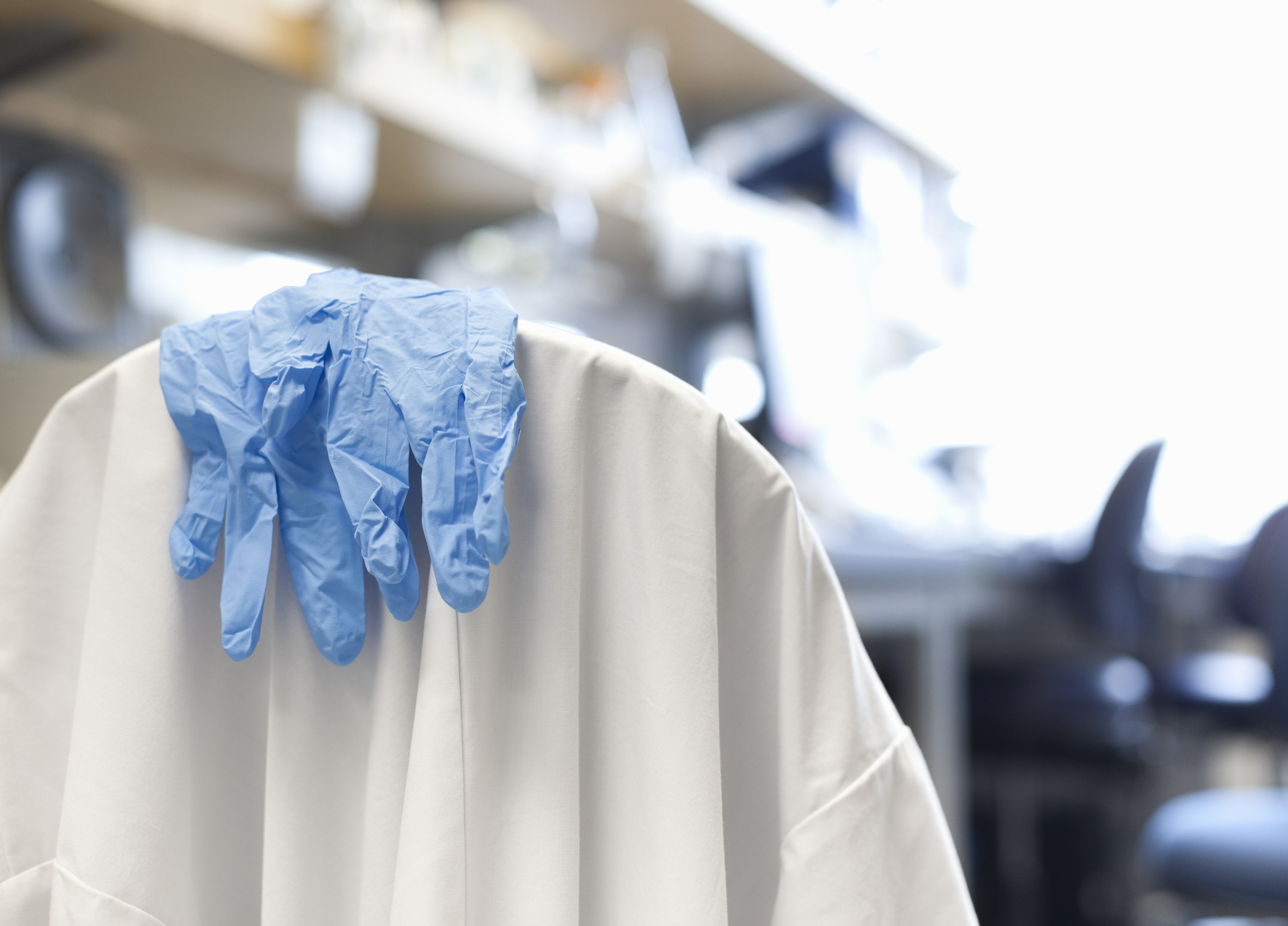 Scientist's gloves and lab coat