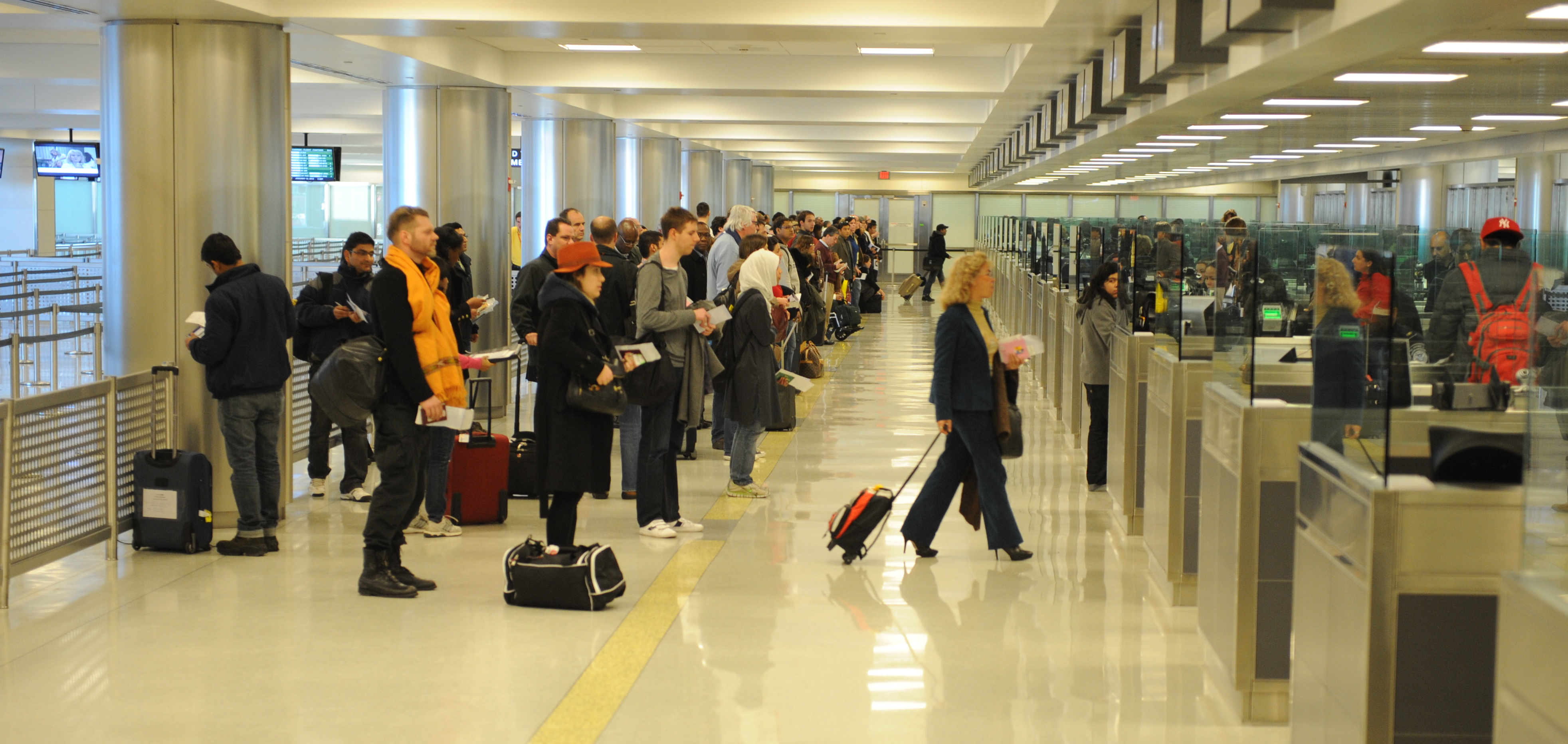 Passengers prepare to pass through international customs at Dulles International Airport on January 13, 2012, in Dulles, VA. (Jahi Chikwendiu/The Washington Post via Getty Images)