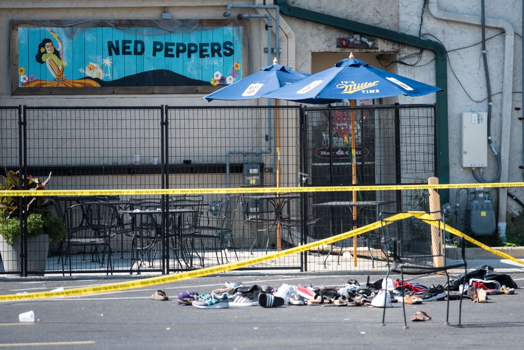 Pairs of shoes are piled behind the Ned Peppers bar belonging to victims of an active shooting that took place in Dayton, Ohio on August 04, 2019. (Megan Jelinger—AFP/Getty Images)