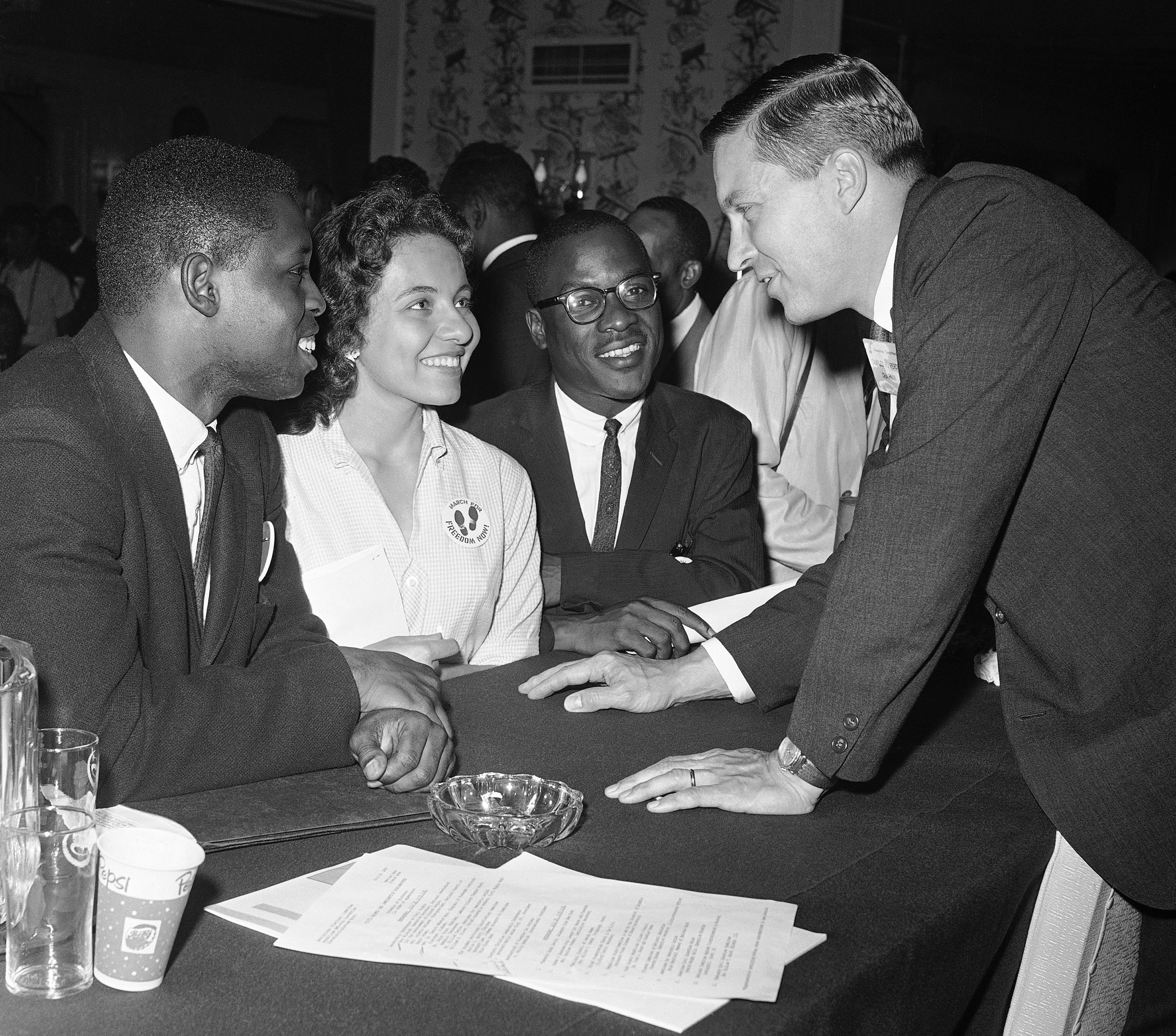 Charles H. Percy (R), chairman of the platform committee of the Republican Party, discusses civil rights with (L-R), Walter Bradford, Diane Nash, and Bernard Lee in Chicago on July 20, 1960. (AP)