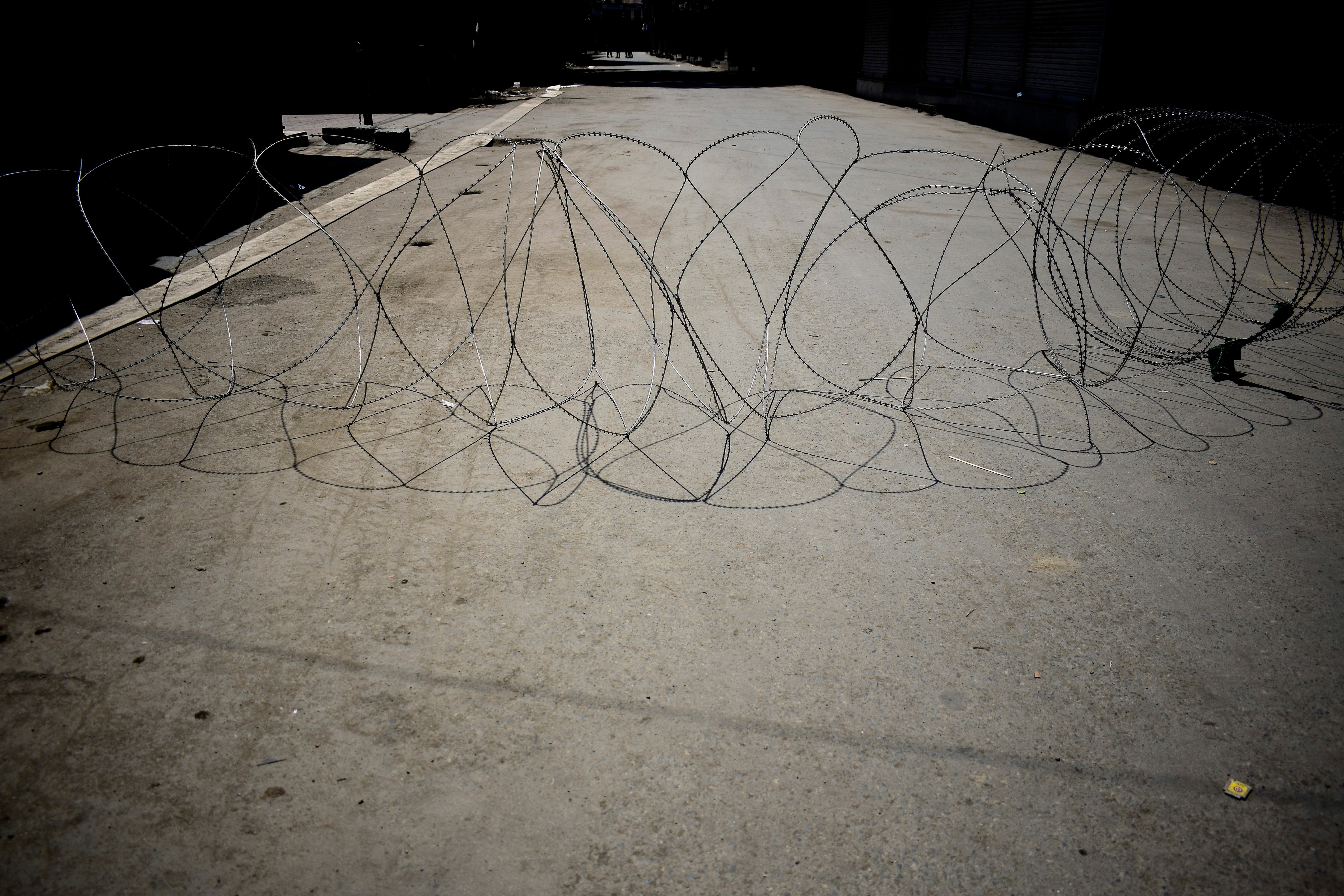 Barbed wire installed to seal roads, imposing curfew, in Srinagar, Kashmir on Aug. 6. (Sanna Irshad Mattoo for TIME)