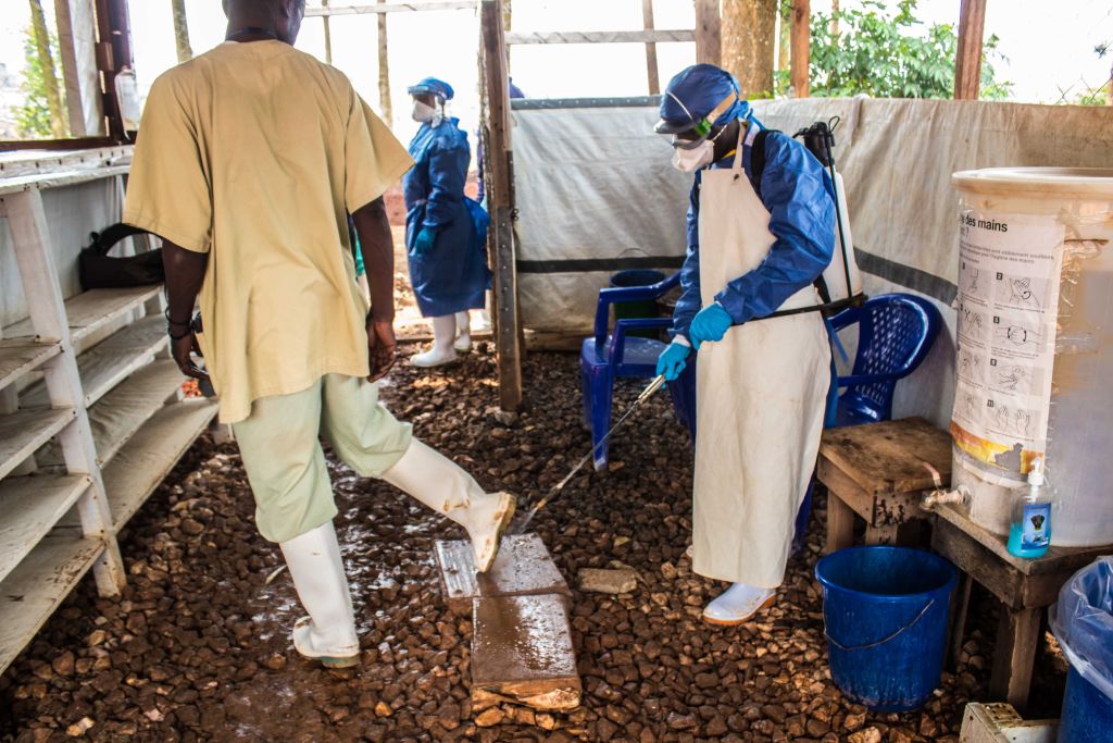 A healthcare worker disinfects a health center with chlorinated water to take precautions against Ebola in Butembo, Democratic Republic of the Congo on July 27, 2019. (Anadolu Agency/Getty Images)