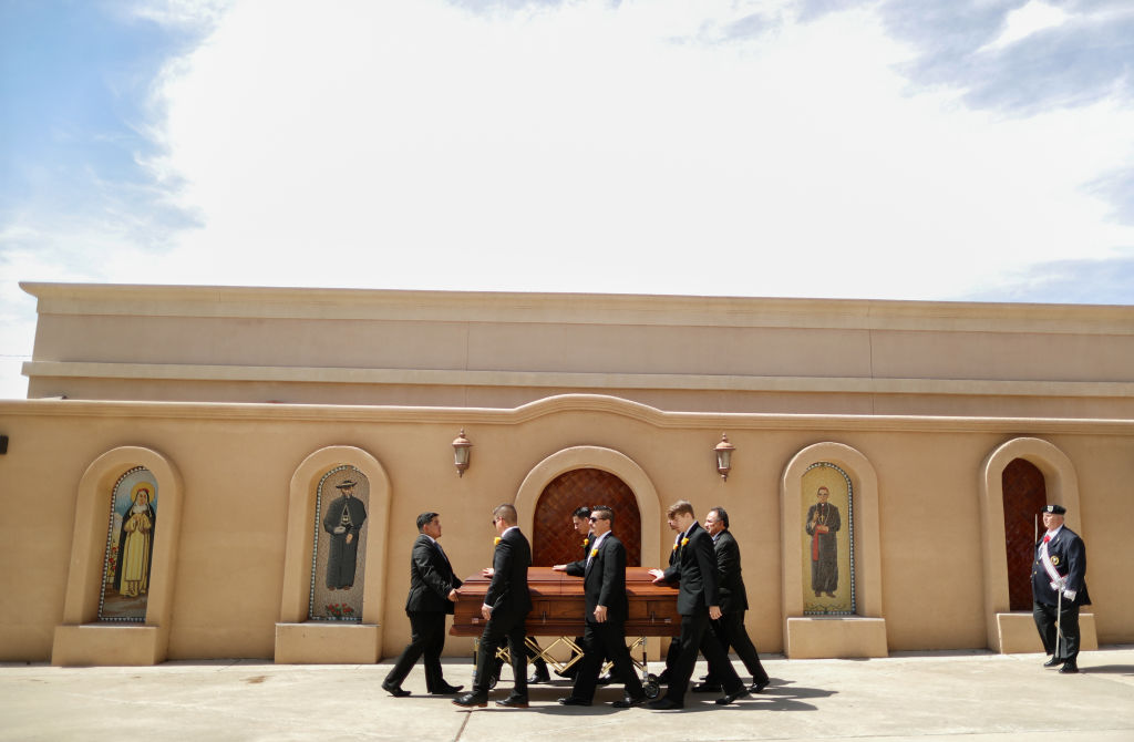 Pallbearers wheel the casket of Angelina Englisbee, 86, who lost her life in the El Paso mass shooting at Walmart, following her funeral Mass at St. Pius X Church on Aug. 9, 2019 in El Paso, Texas. (Mario Tama&mdash;Getty Images)
