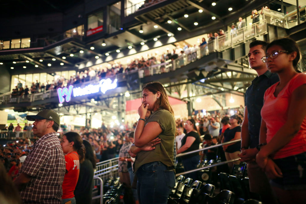 People attend a community memorial service honoring victims of the mass shooting earlier this month which left 22 people dead and 24 more injured, at Southwest University Park on August 14, 2019 in El Paso, Texas. (Sandy Huffaker—Getty Images)
