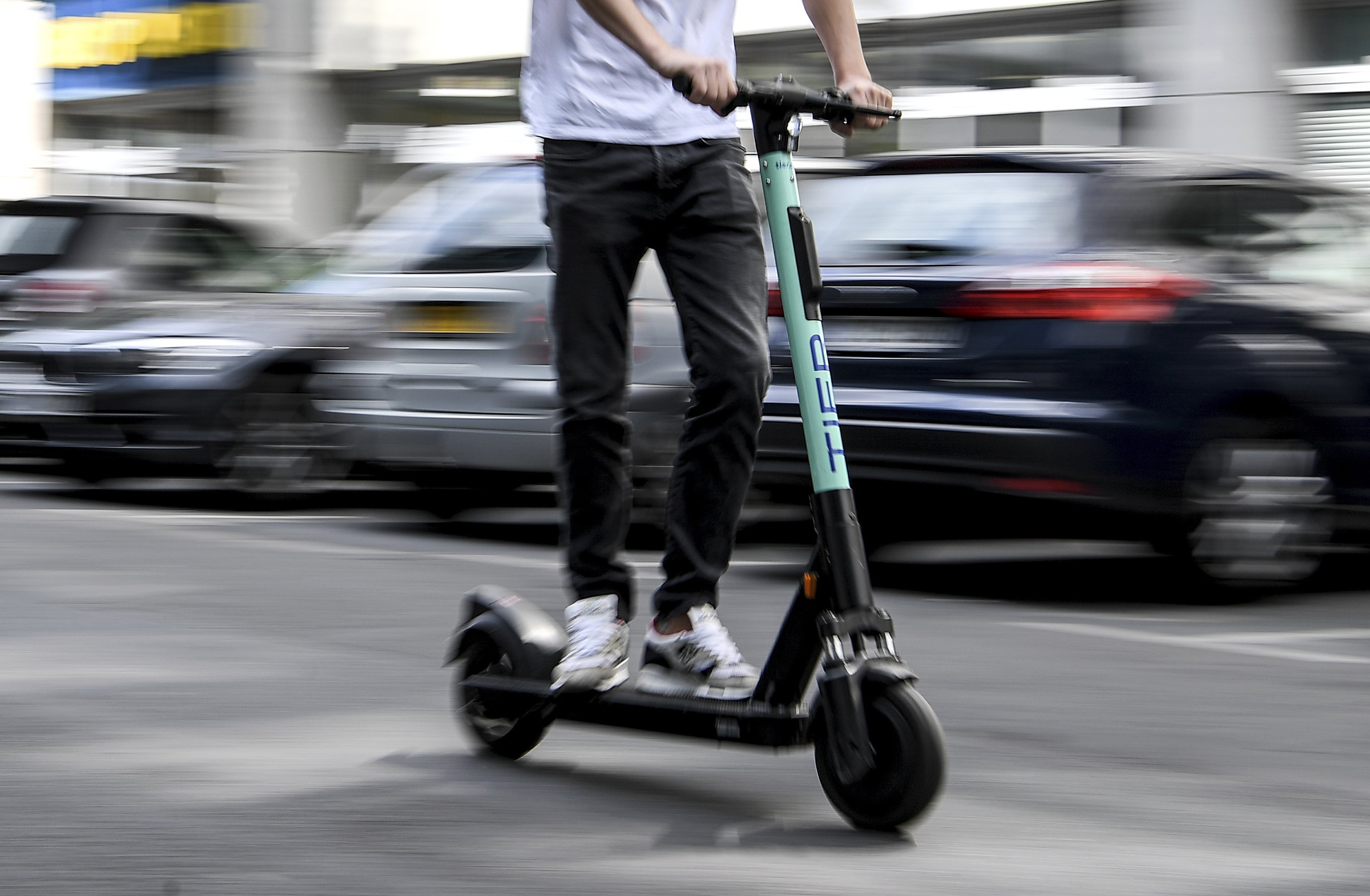 A man drives an electric pedal scooter from Tier in Berlin, Germany. (Britta Pedersen—picture-alliance/dpa/AP)