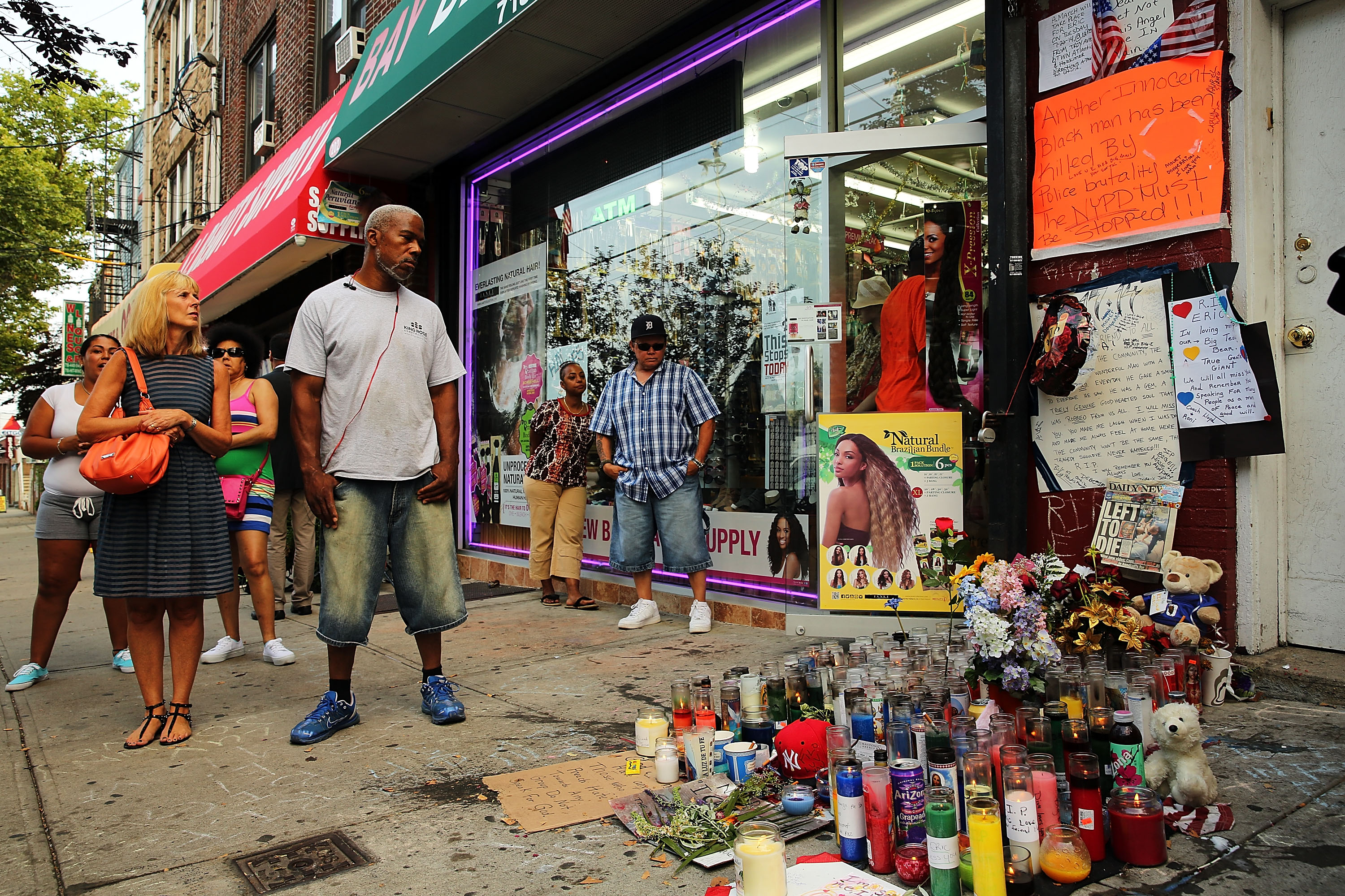 People attend a vigil for Eric Garner near where he died after he was taken into police custody in Staten Island last Thursday on July 22, 2014 in New York City. (Spencer Platt—Getty Images)
