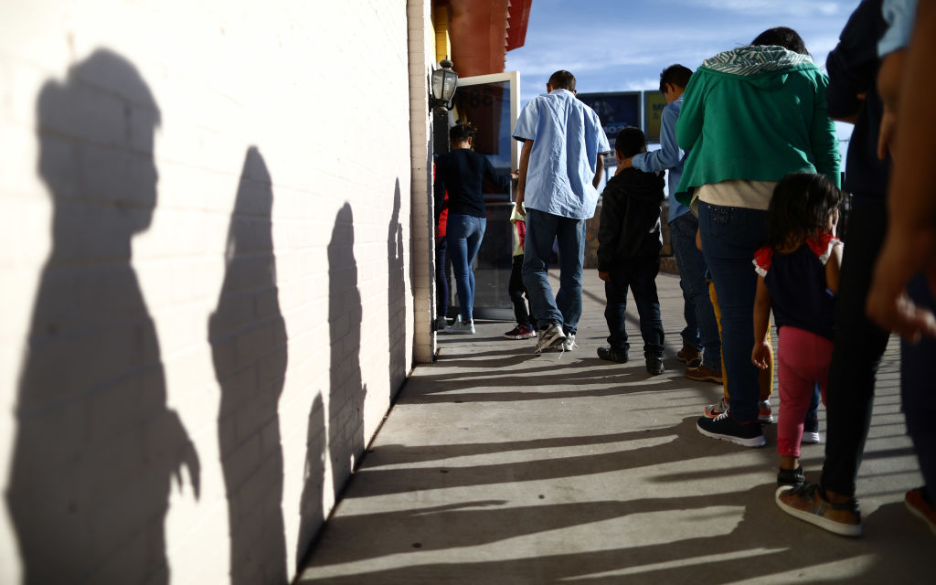 Recently arrived migrants from Central America line up to receive dinner at a church shelter for migrants who are seeking asylum on May 18, 2019 in El Paso, Texas. (Mario Tama&mdash;Getty Images)