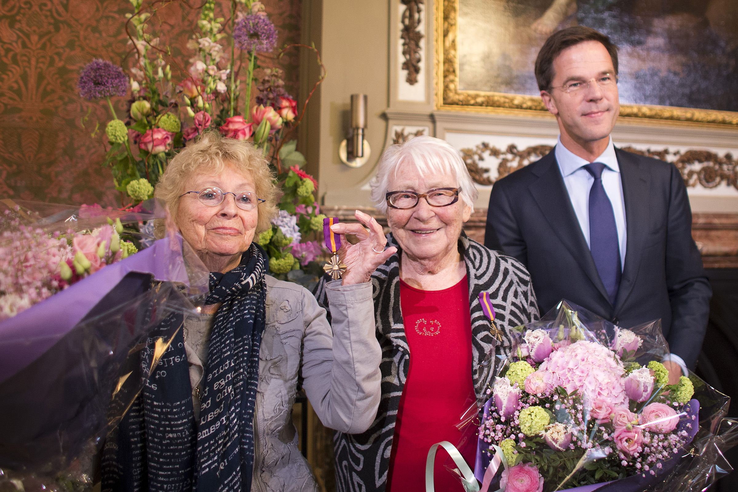 In 2014, Ms. Freddie Oversteegen, left, and her sister, Truus, were awarded the Mobilization War Cross by Mark Rutte, the Dutch prime minister. (Dutch Ministry of Defense)