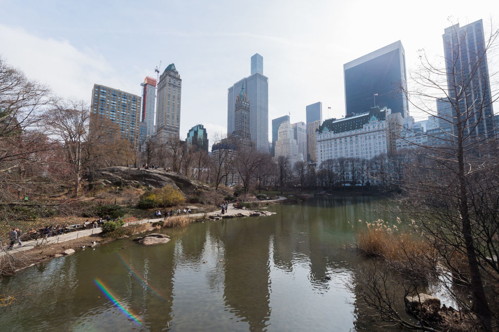 Wides shots of Central Park featuring people sitting at benches by the pond and tall skyscrapers outlining Now Yorks city skyline in New York City on Feb 28th 2017. (James D. Morgan&mdash;Getty Images)