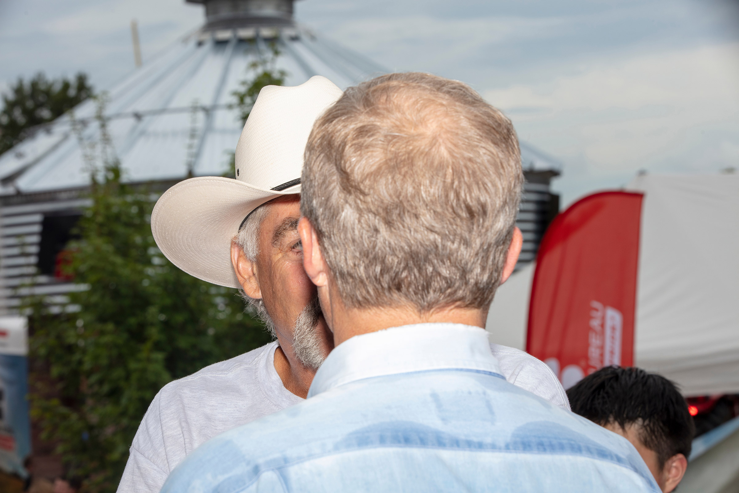 Democratic presidential candidate Tom Steyer speaks with farmer Kyle Gilchrist of Douds, Iowa on Aug. 11. Gilchrist was concerned about how an increasing minimum wage would affect him paying his farm workers. (M. Scott Brauer for TIME)