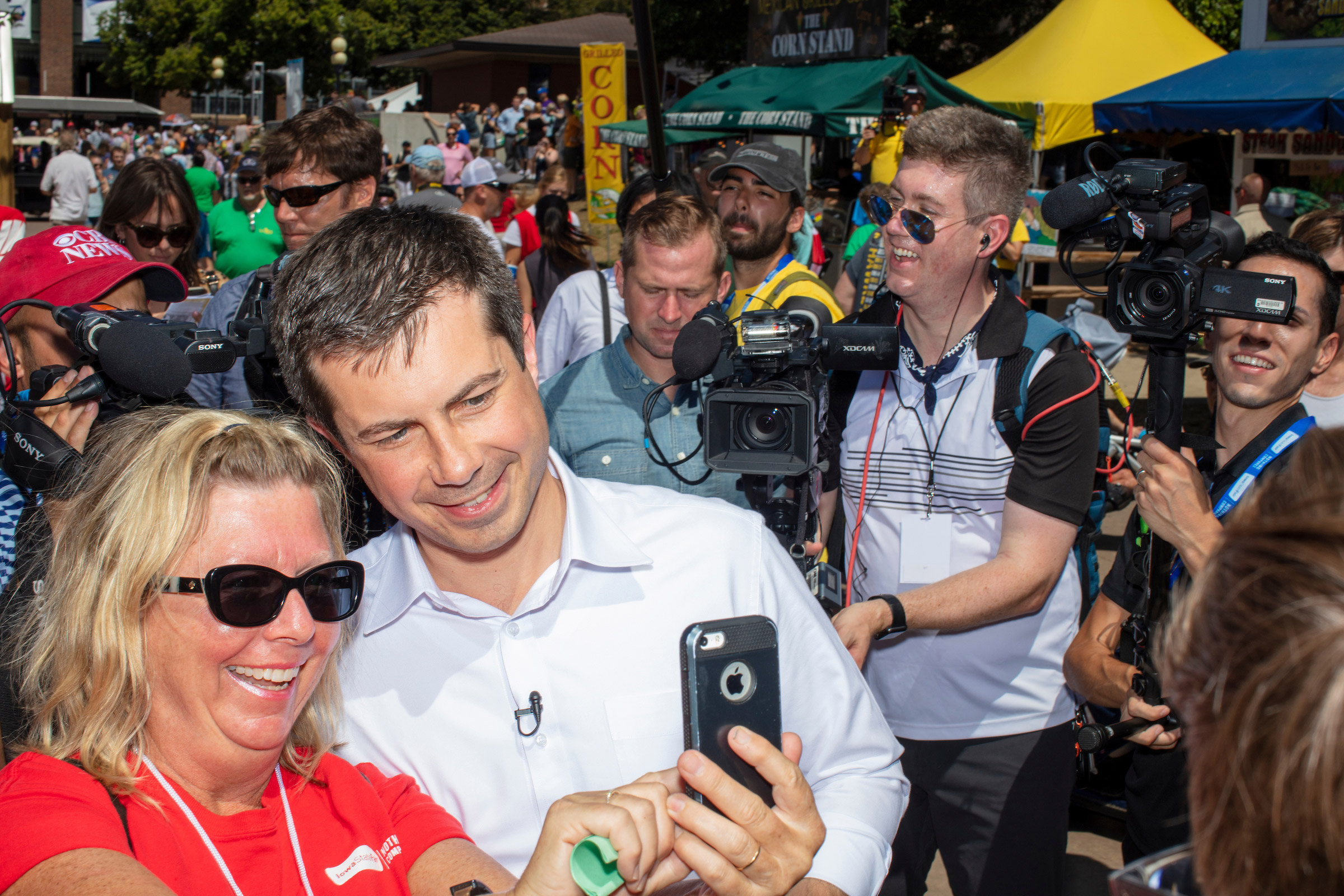 South Bend mayor and Democratic presidential candidate Pete Buttigieg greets people as he walks through the Iowa State Fair on Aug. 13. (M. Scott Brauer for TIME)