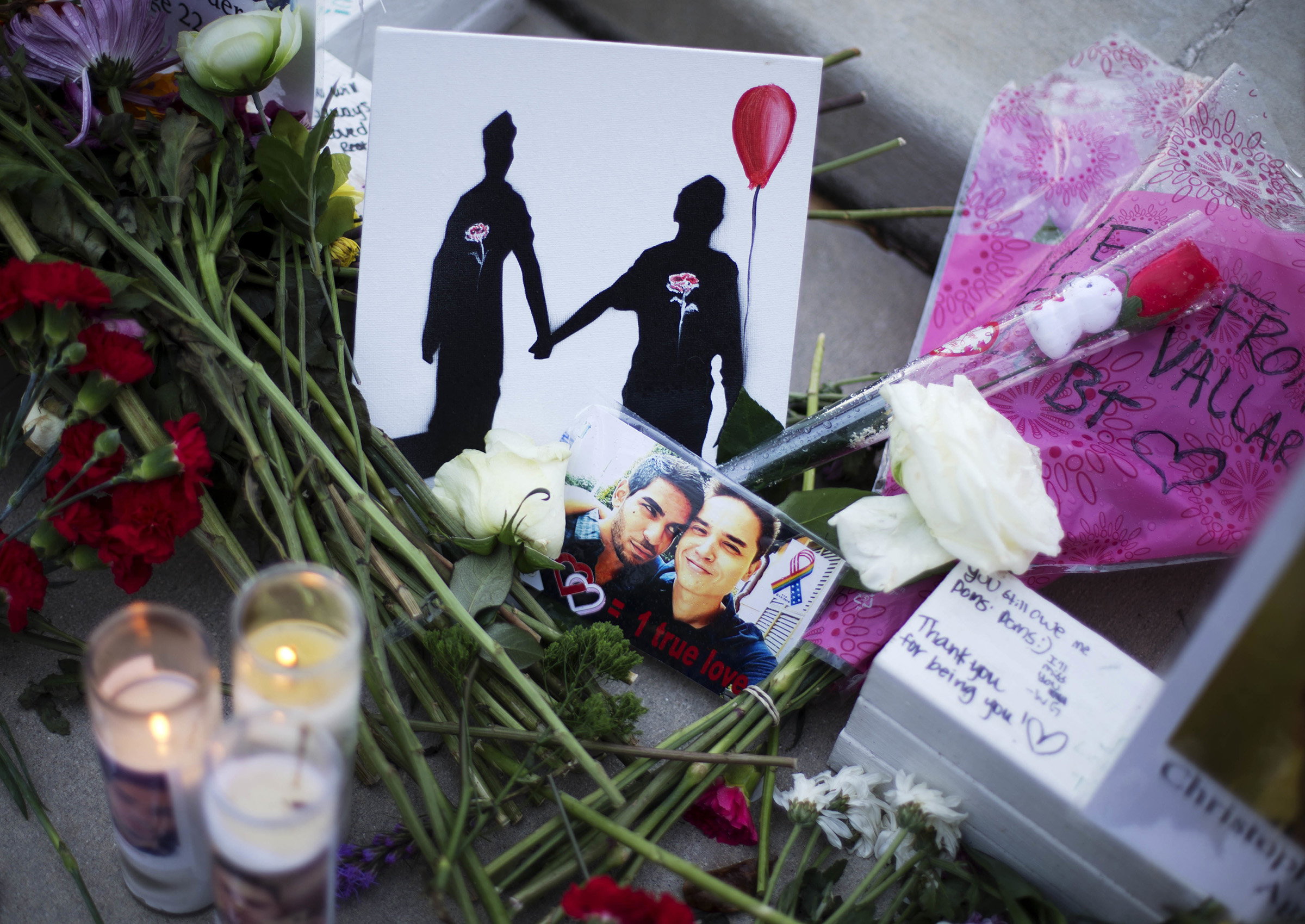 A makeshift memorial to Christopher Andrew Leinonen (R) and his boyfriend Juan Ramon Guerrero (L) on June 19, 2019. They were both killed in the Pulse nightclub mass shooting in Orlando. (David Goldman—AP)