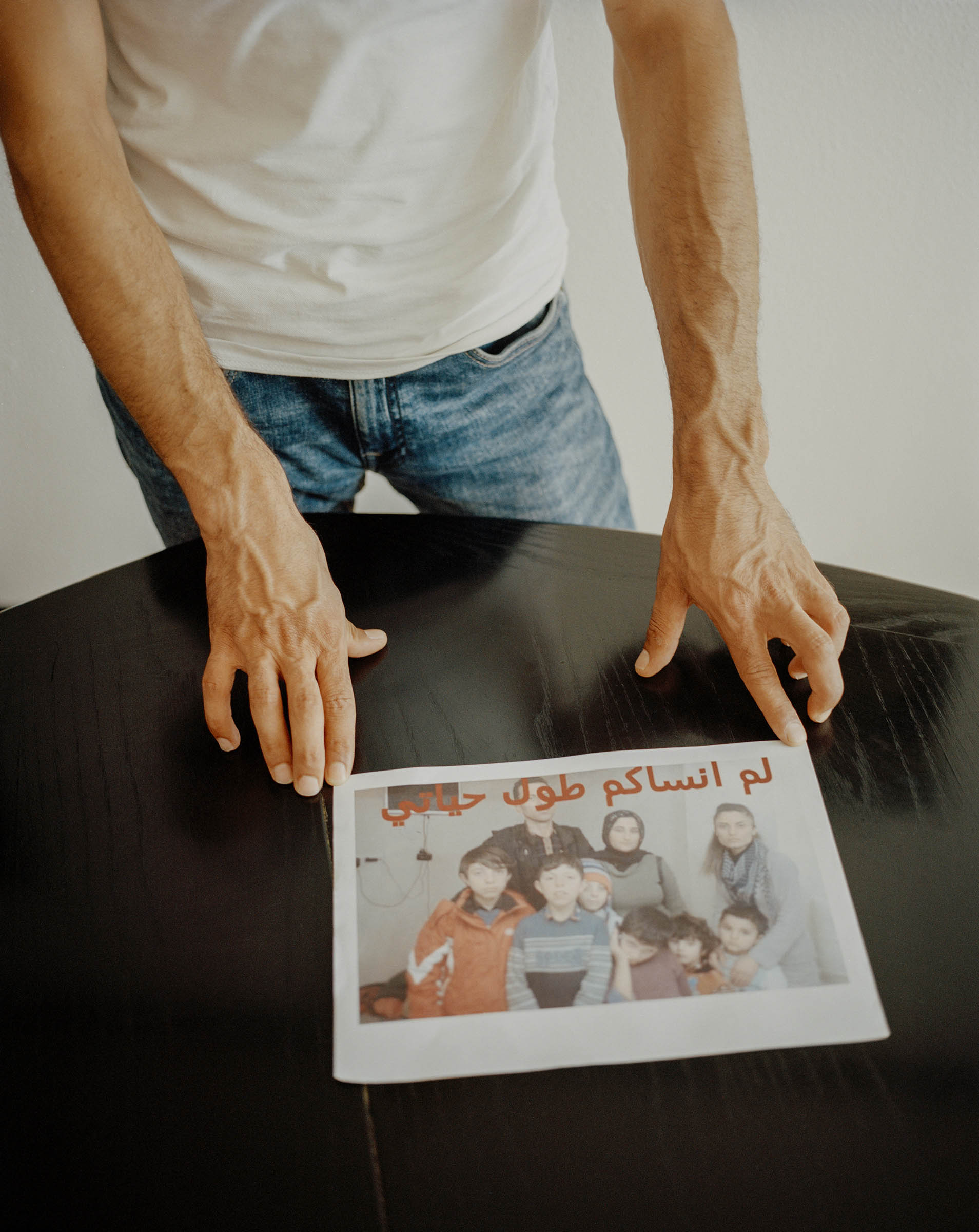 Walid Khalil Murad with his only photograph of his family. He lives in the village Theley in Saarland in southern Germany. Thursday, July 25, 2019.Photograph by Mustafah Abdulaziz