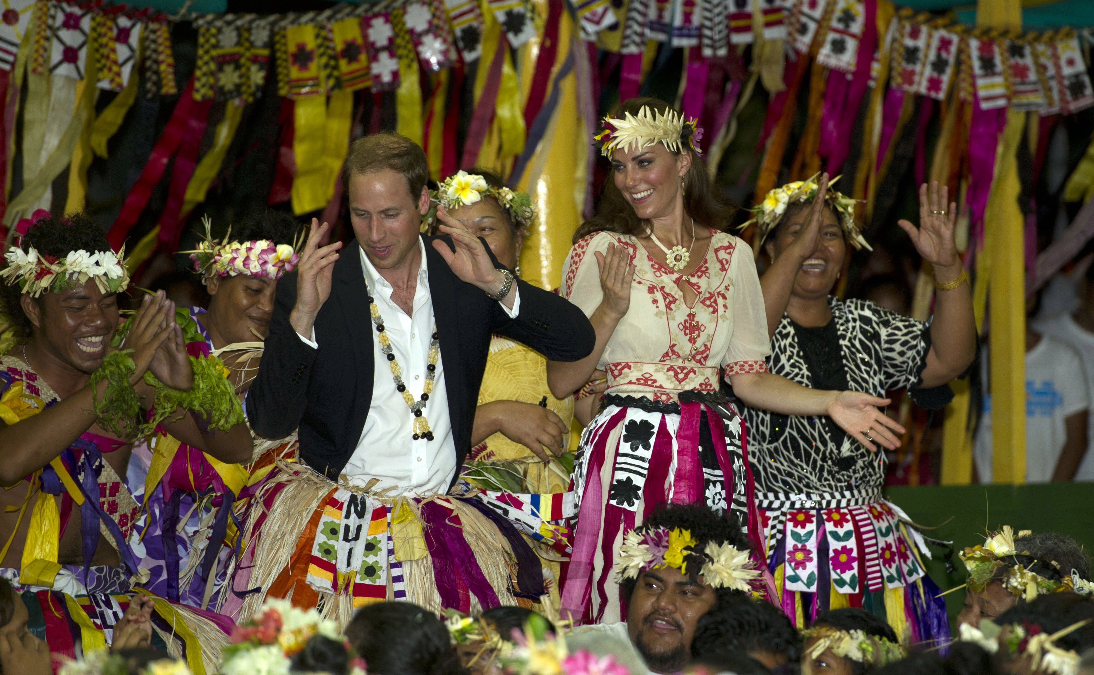 Prince William, Duke of Cambridge and Catherine, Duchess of Cambridge and dance with local ladies at a Vaiku Falekaupule Ceremony during the Royal couple's Diamond Jubilee tour of the Far East on September 18, 2012 in Funafuti, Tuvalu. (Samir Hussein—WireImage)
