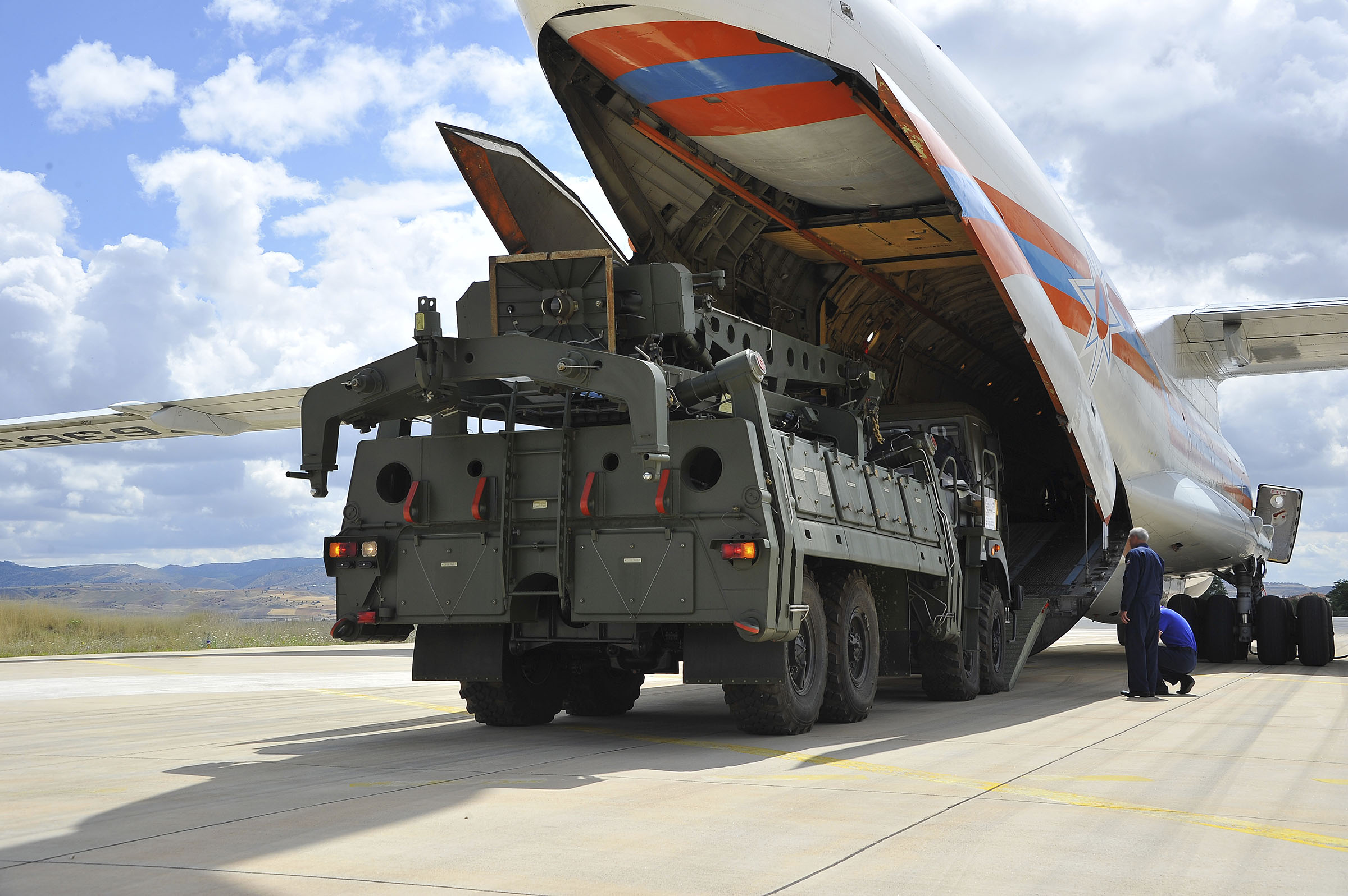 Military vehicles and equipment, parts of the S-400 air defense systems, are unloaded from a Russian transport aircraft, at Murted military airport in Ankara, Turkey on July 12, 2019. (Turkish Defence Ministry via AP)