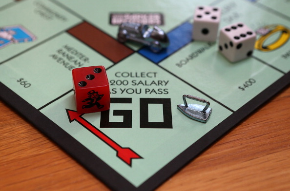 The Monopoly iron game piece is displayed on the Monopoly game board in Fairfax, California on February 6, 2013. (Justin Sullivan—Getty Images)