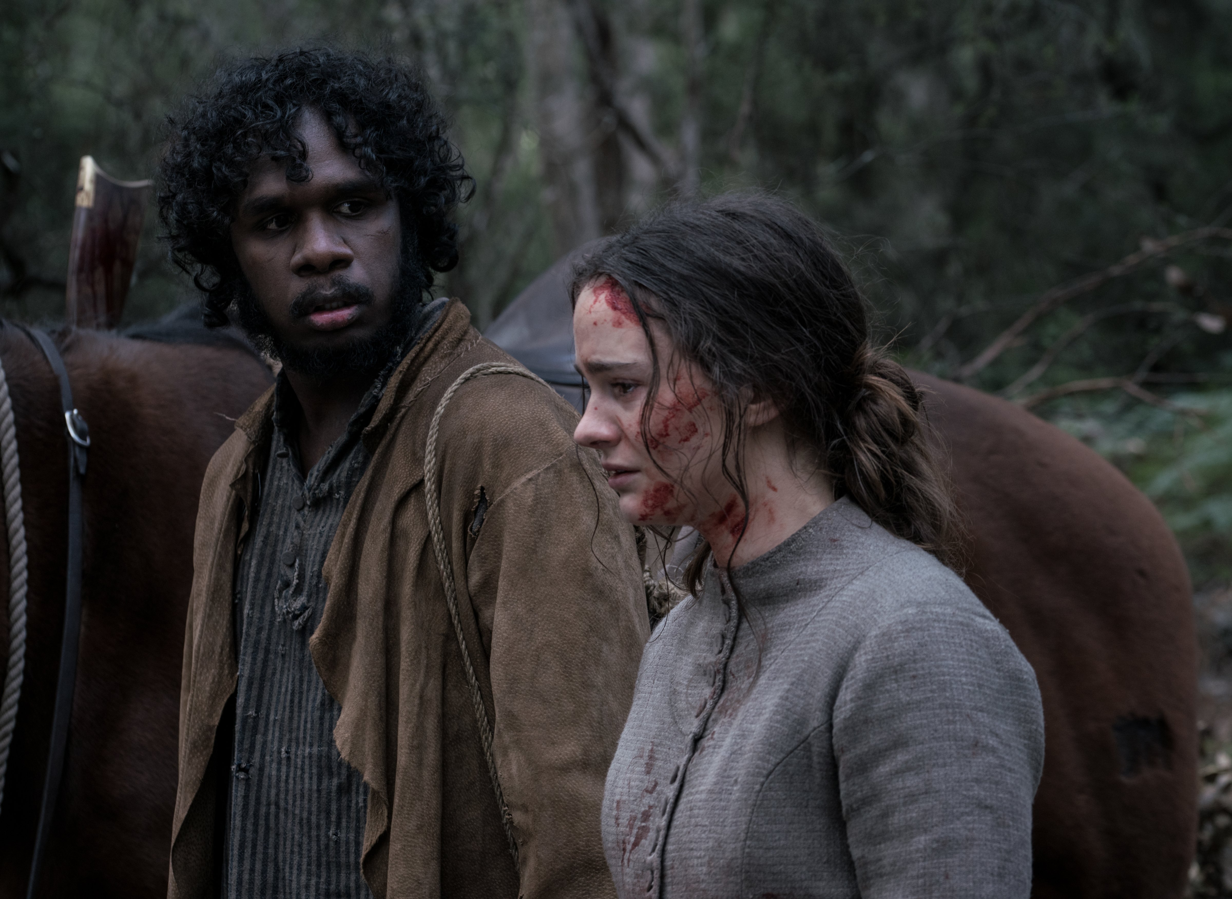 Baykali Ganambarr as “Billy” and Aisling Franciosi as “Clare” in Jennifer Kent’s The Nightingale. Courtesy of IFC Films. An IFC Films release. (Baykali Ganambarr as “Billy” and Aisling Franciosi as “Clare” in Jennifer Kent’s The Nightingale. Courtesy of IFC Films. An IFC Films release.)