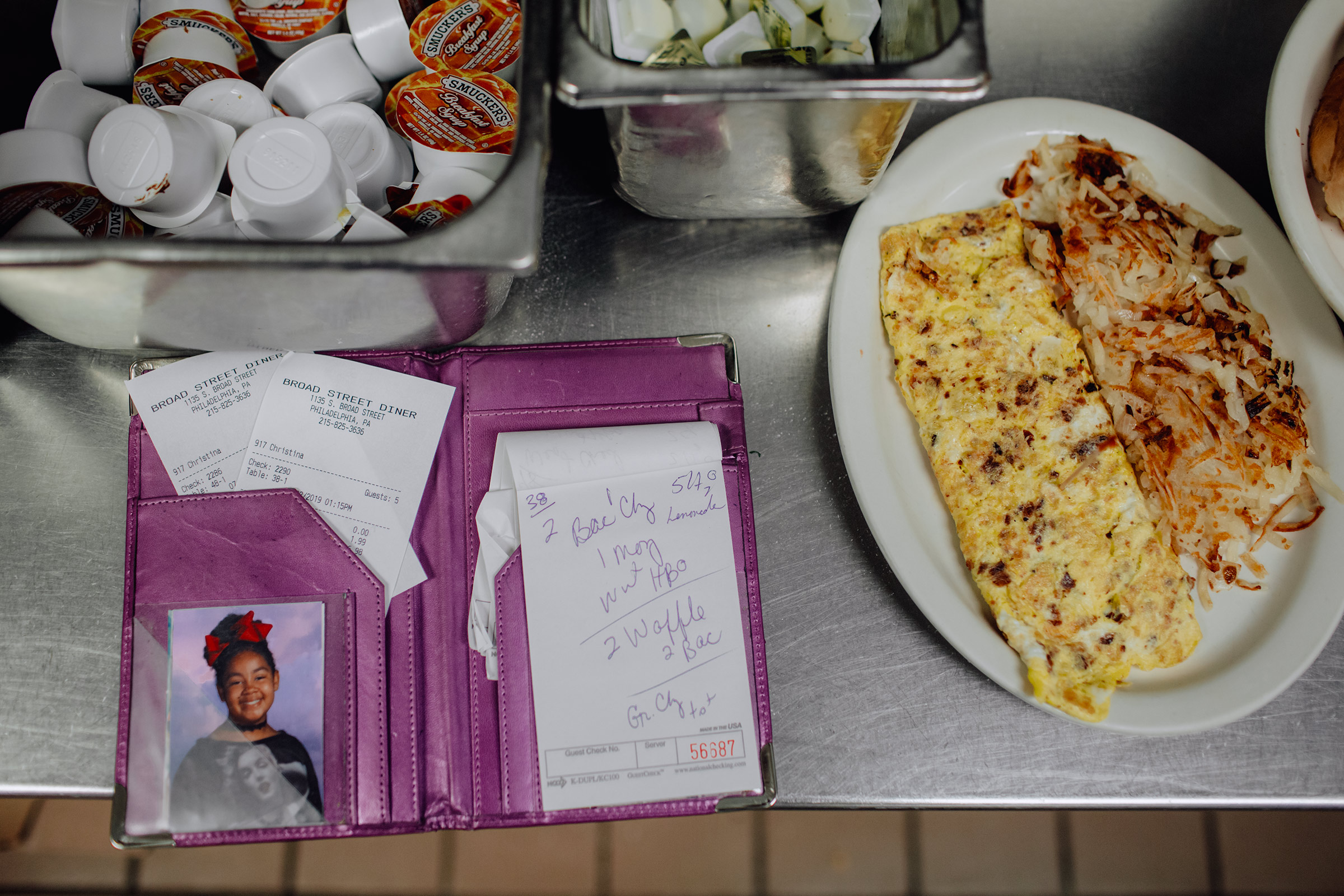 In the kitchen at the Broad Street Diner in Philadelphia, waitress Christina Munce keeps her daughter’s photo next to her pad for taking orders. (Sasha Arutyunova for TIME)
