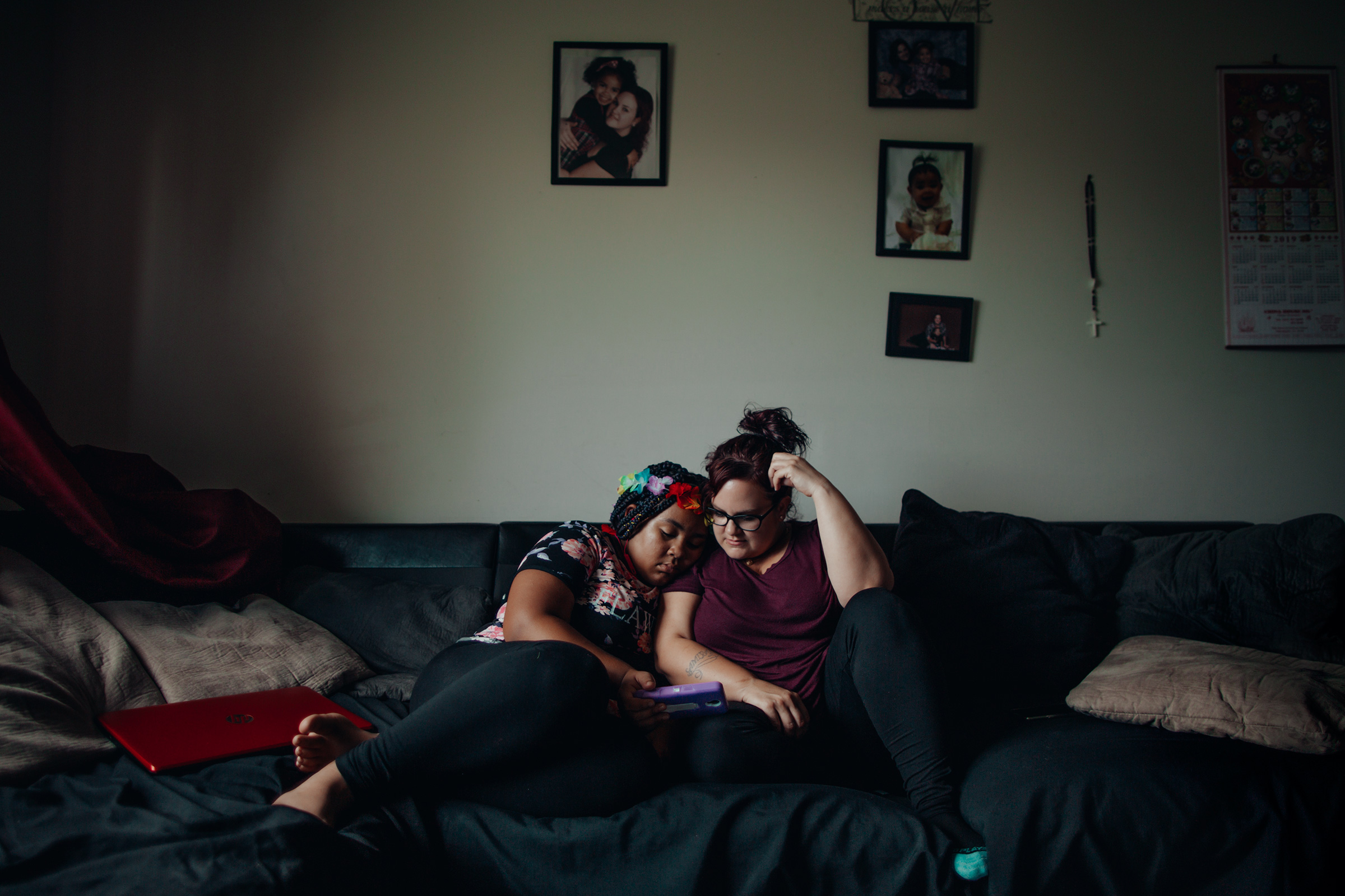 Munce cuddles with her daughter in their apartment in southwest Philadelphia. (Sasha Arutyunova for TIME)