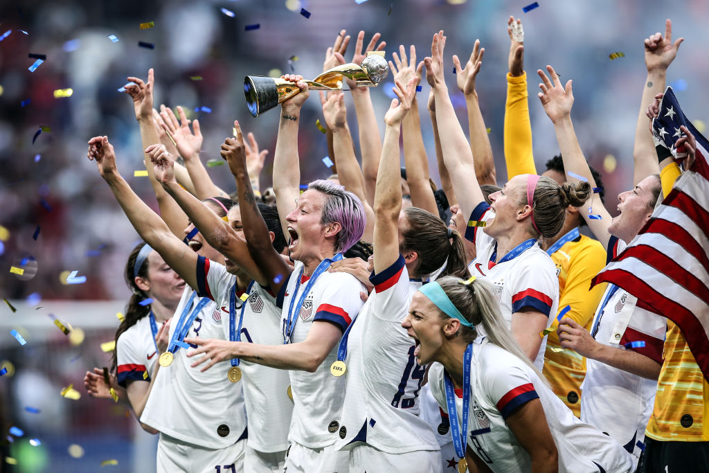 Megan Rapinoe of the USA lifts the FIFA Women's World Cup Trophy following her team's victory in the 2019 FIFA Women's World Cup France Final match between The United States of America and The Netherlands at Stade de Lyon on July 07, 2019 in Lyon, France. (Alex Grimm—Getty Images)