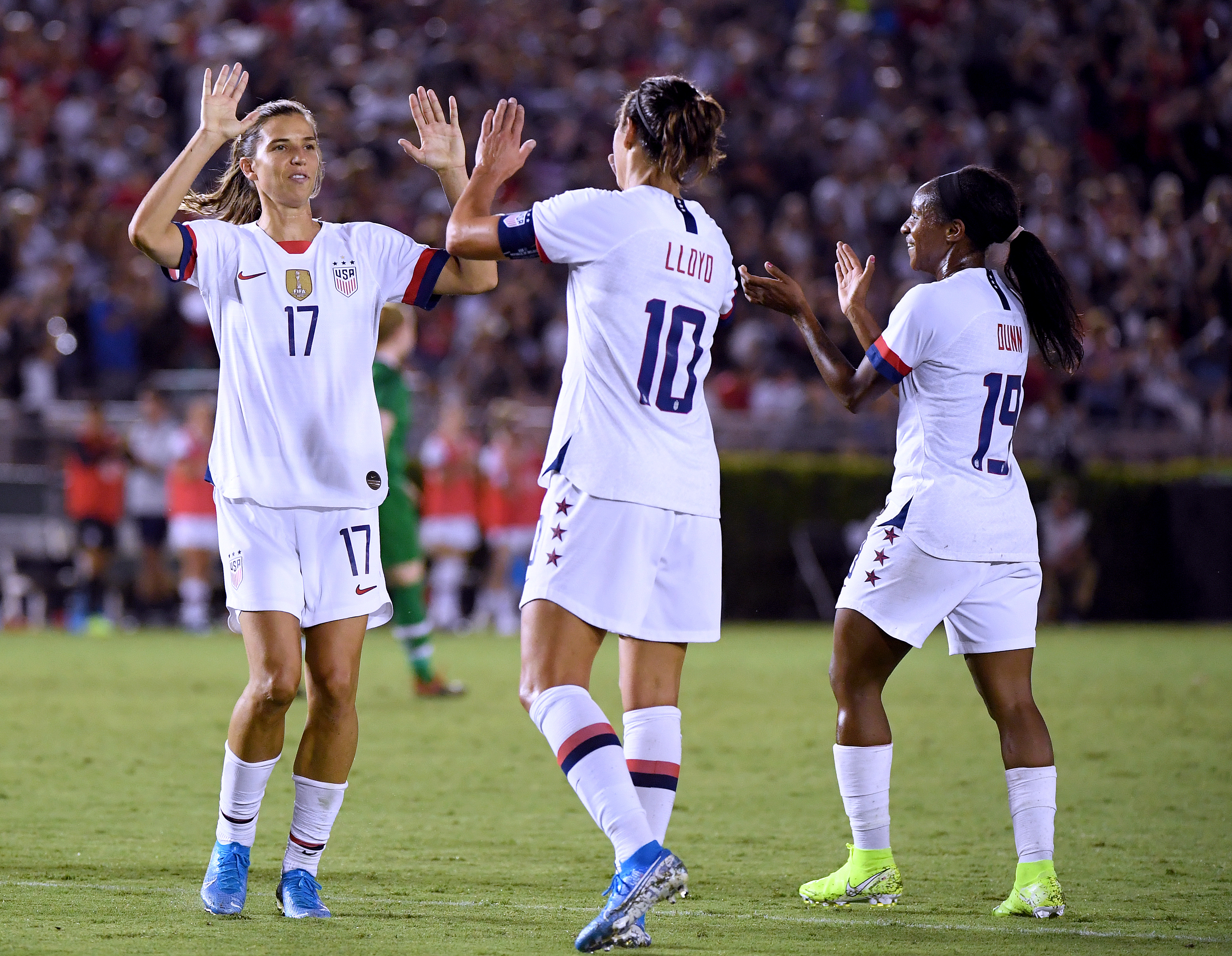 Carli Lloyd #10 of the United States celebrates her goal with Tobin Heath #17 and Crystal Dunn #19, to take a 3-0 lead over the Republic of Ireland, during the first half of the first game of the USWNT Victory Tour at Rose Bowl on August 03, 2019 in Pasadena, California. (Harry How—Getty Images)