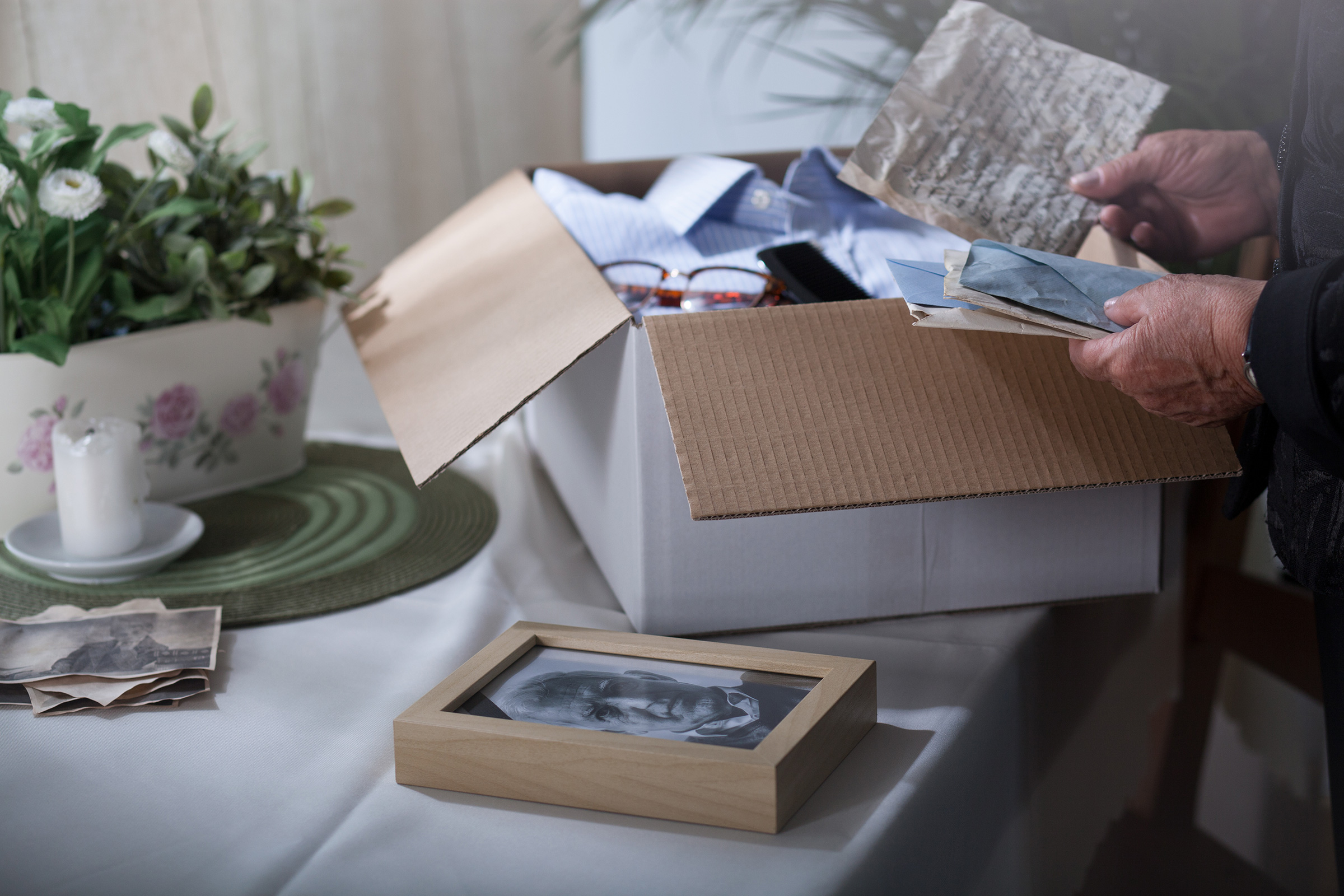 It may sound morbid, but creating a findable file, binder, cloud-based drive, or even shoebox where you store estate documents and meaningful personal effects will save your loved ones incalculable time, money, and suffering. (Getty Images/iStockphoto)