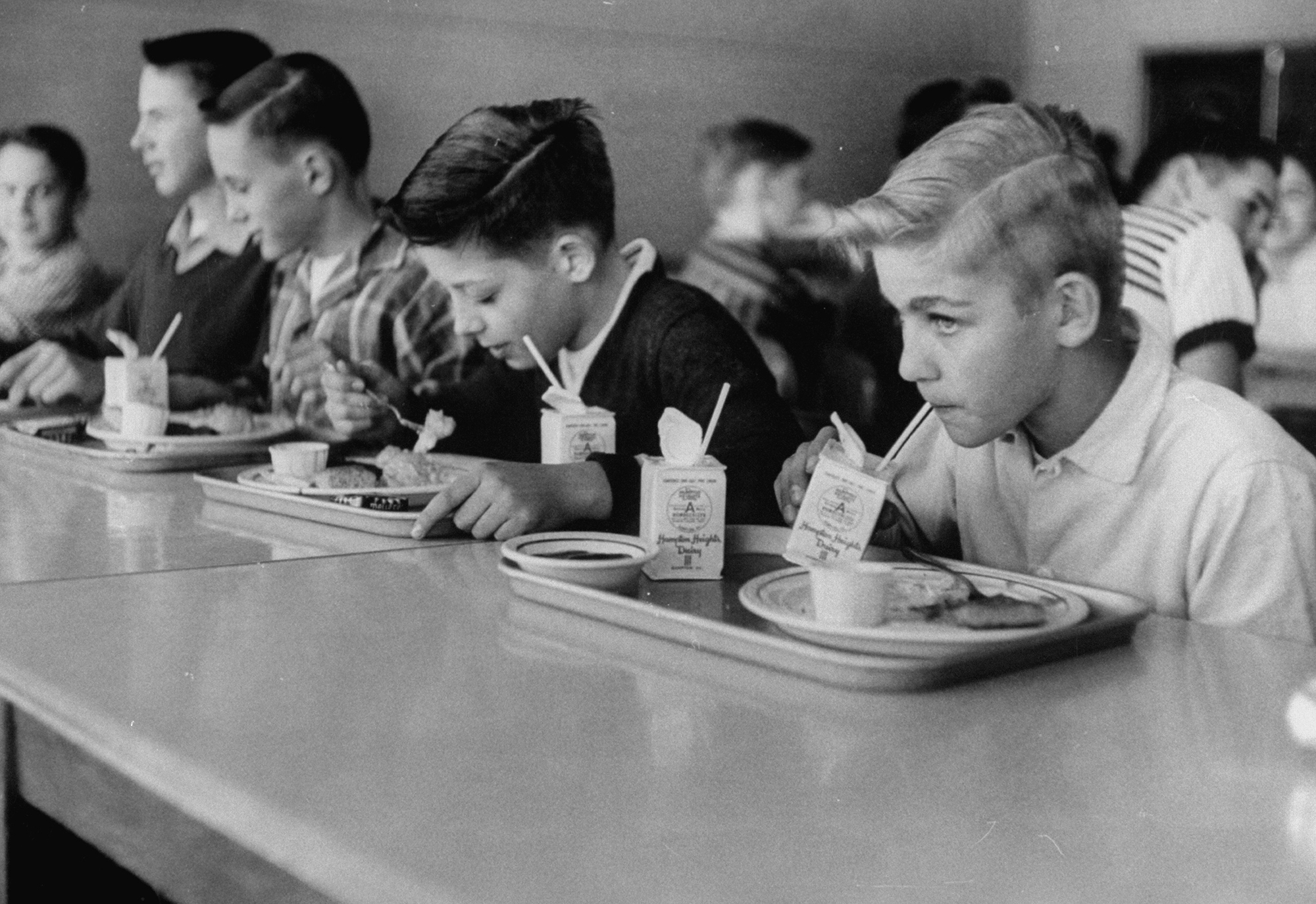 Boys eating in the school cafeteria.  (P