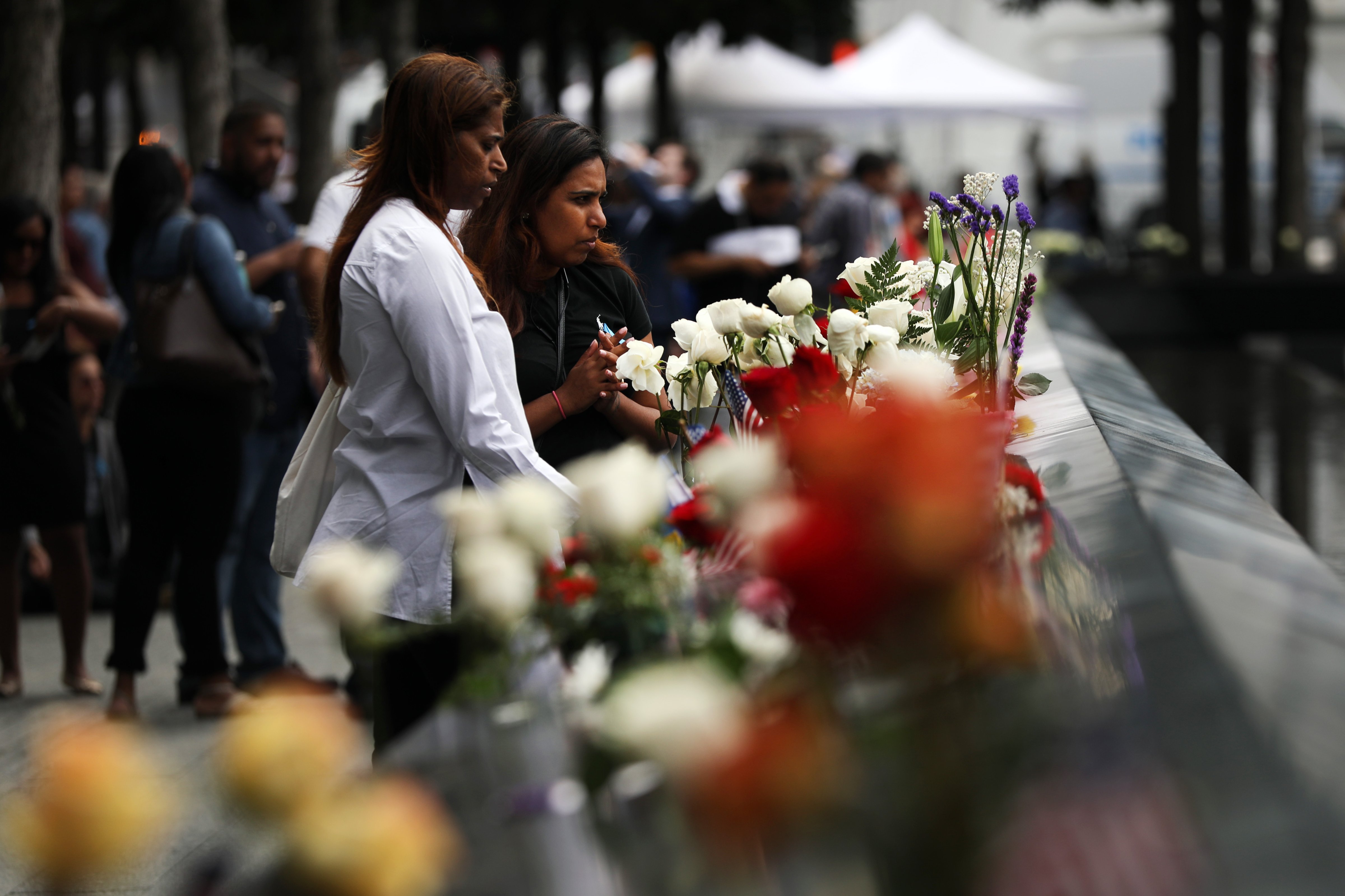 Friends and family of victims of the 9/11 terrorist attacks, pause at the National September 11 Memorial during a morning commemoration ceremony for the victims of the terrorist attacks Eighteen years after the day on September 11, 2019 in New York City. (Spencer Platt&mdash;Getty Images)