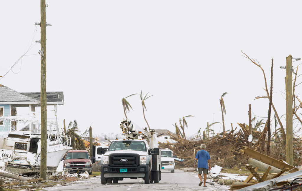 A power authority truck parks near downed wires on devastated Great Abaco Island on Sept. 6, 2019 in the Bahamas. (Jose Jimenez—Getty Images)