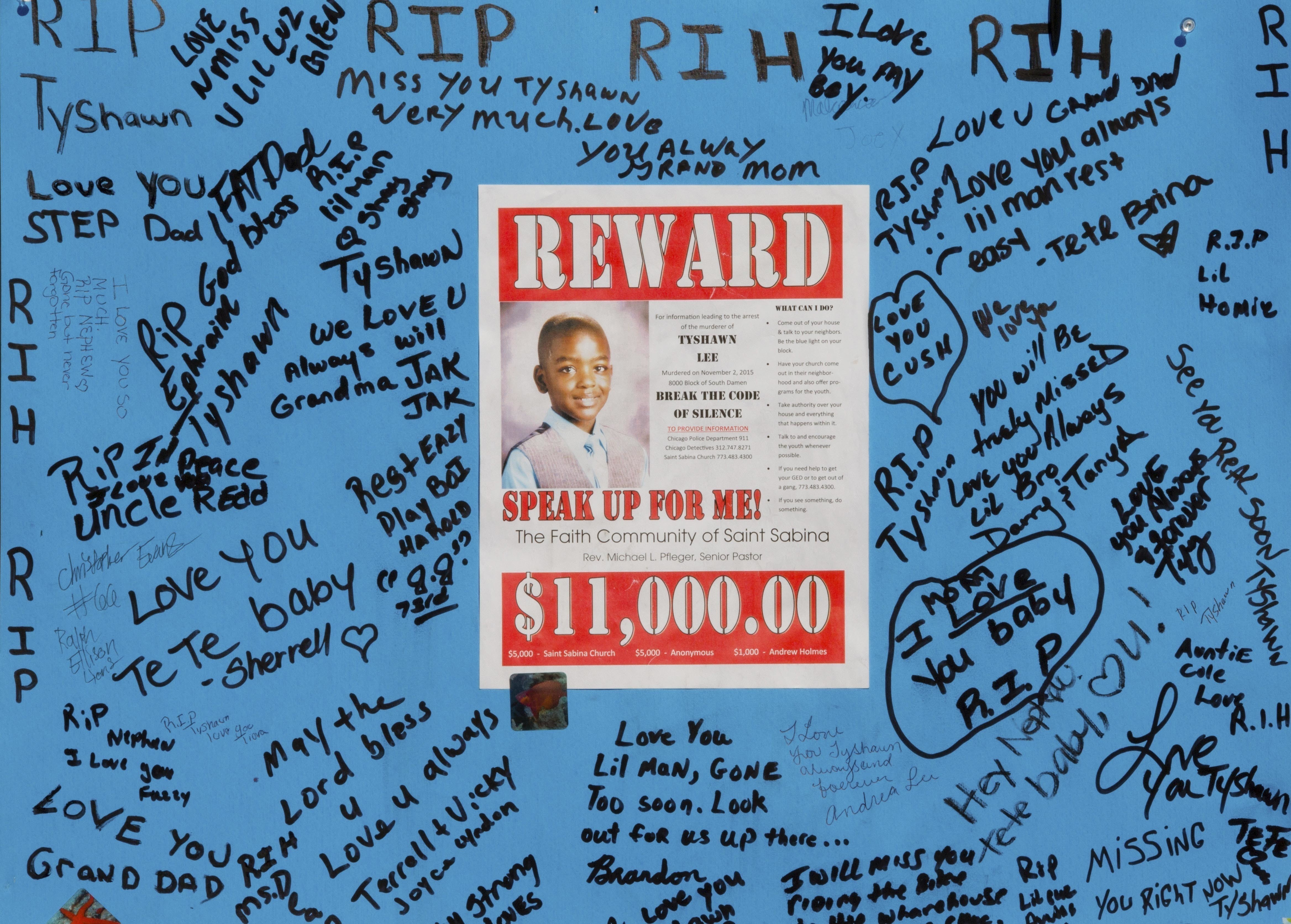 In this Nov. 4, 2015, file photo, a reward sign and messages hang near the site where Tyshawn Lee was fatally shot in Chicago. (Teresa Crawford&mdash;AP)