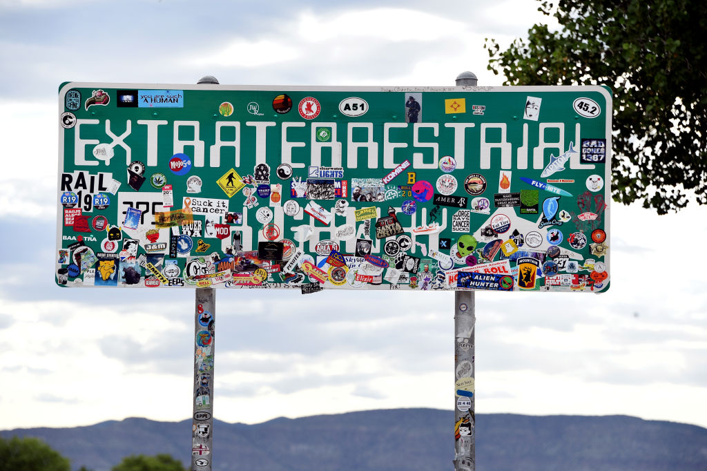 An Extraterrestrial Highway sign covered with stickers is seen along state route 375 on July 22, 2019 near Rachel, Nevada. (David Becker—Getty Images)