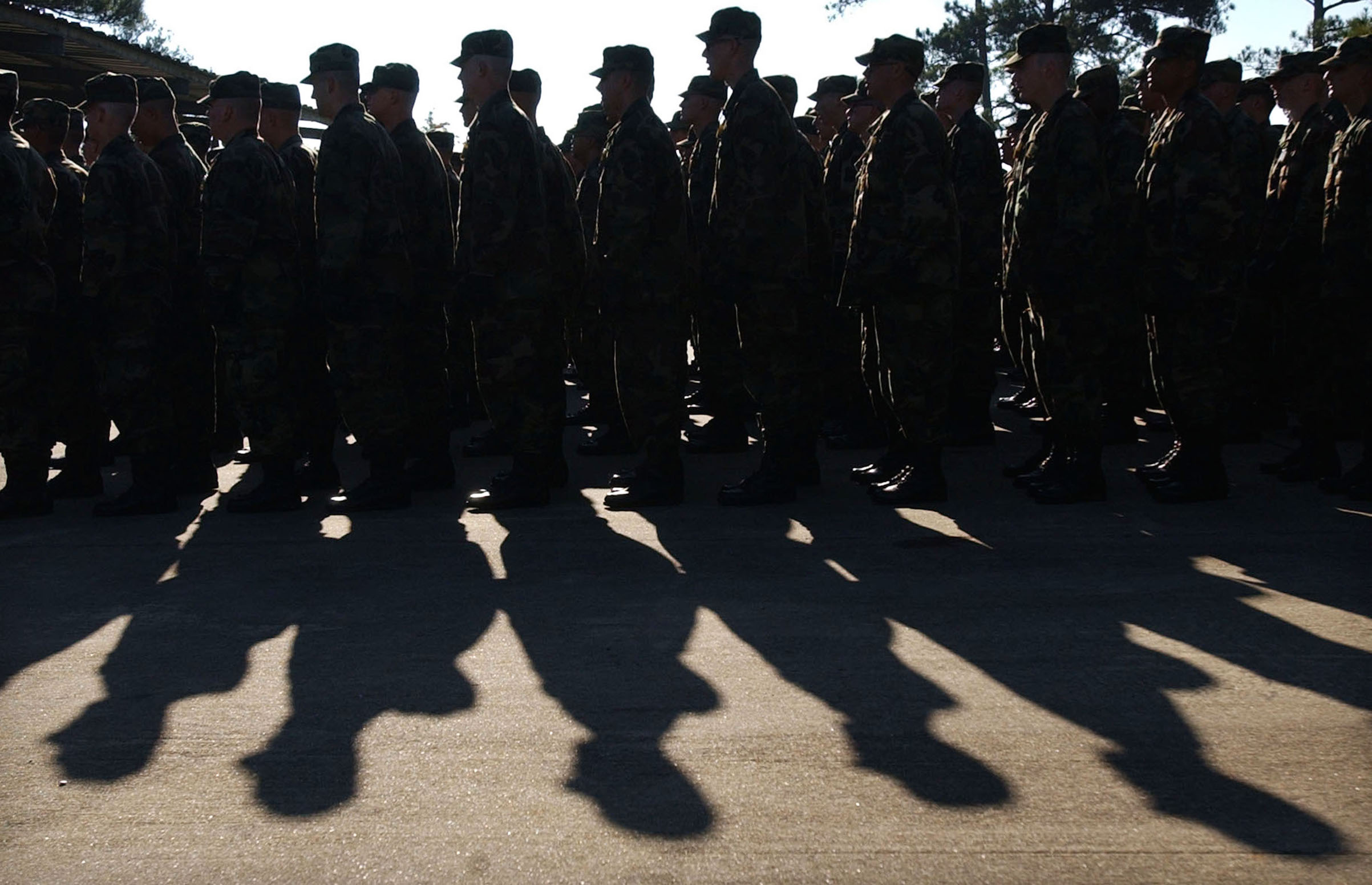 U.S. Soldiers with Delta Company line up to take part in morning team development exercises Nov. 7, 2002 in Fort Benning, Ga. Over 24,000 soldiers every year go through U.S. Army basic training at Fort Benning. (Barry Williams—Getty Images)
