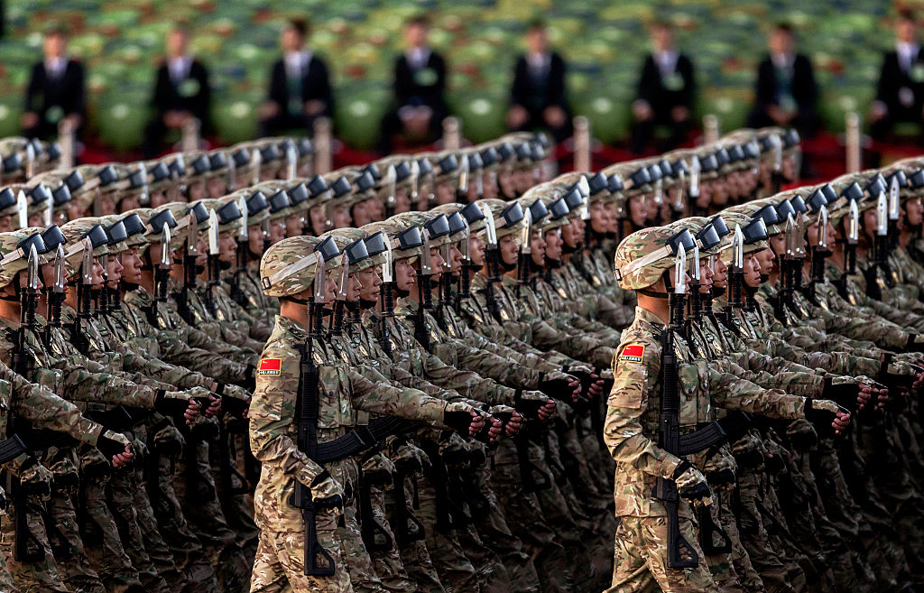 Chinese soldiers march past Tiananmen Square before a military parade on September 3, 2015 in Beijing, China. (Kevin Frayer—Getty Images)