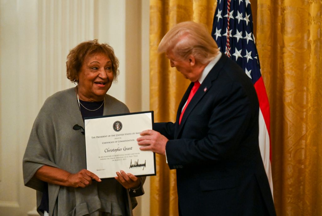 In the East Room of the White House, Donald Trump presents a Certificate of Commendation to Mimi Grant on behalf of her son, Christopher. (The Washington Post&mdash;The Washington Post/Getty Images)
