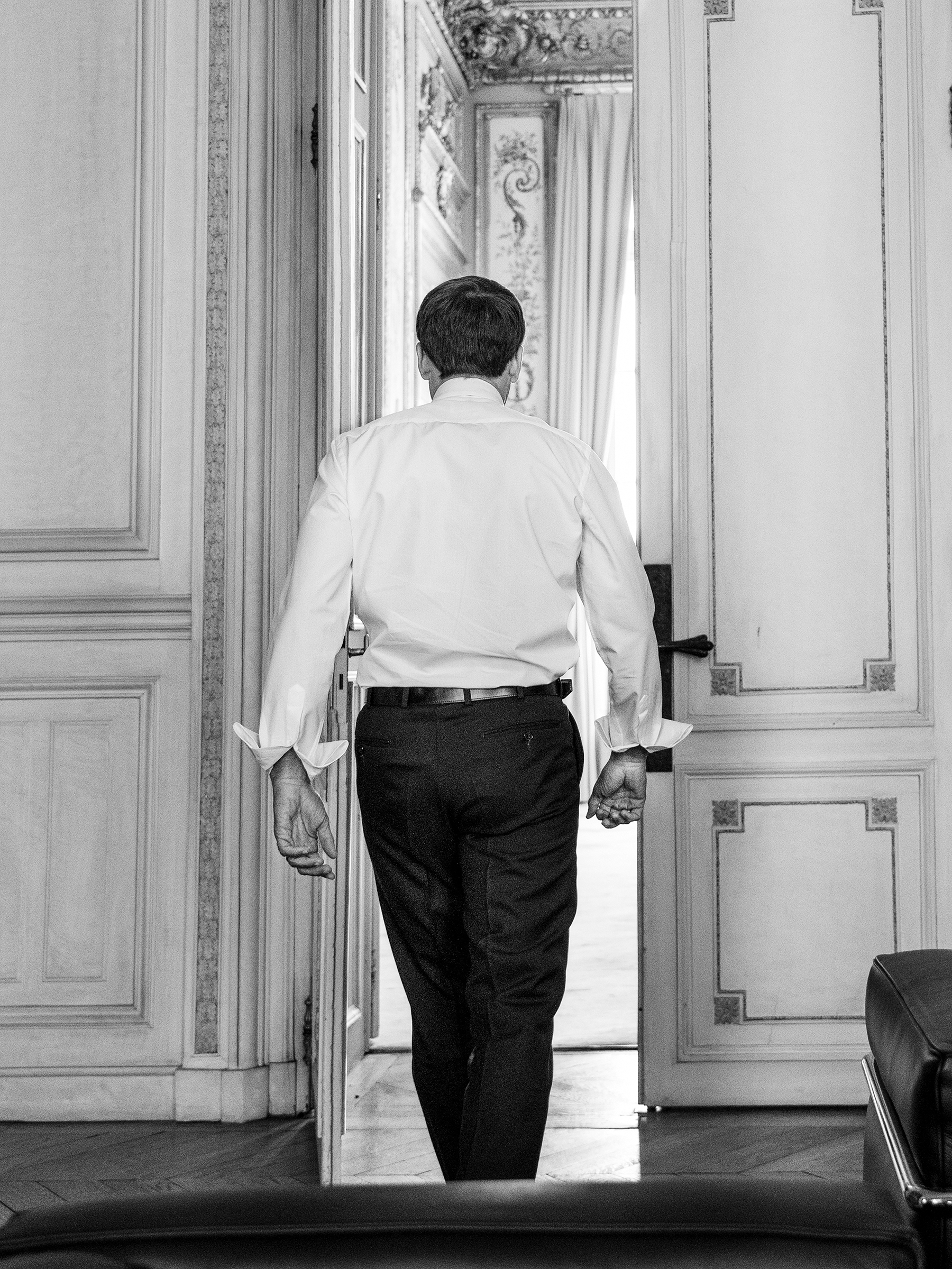 Macron steps out of a high-level meeting in the Élysée Palace in Paris on Sept. 9