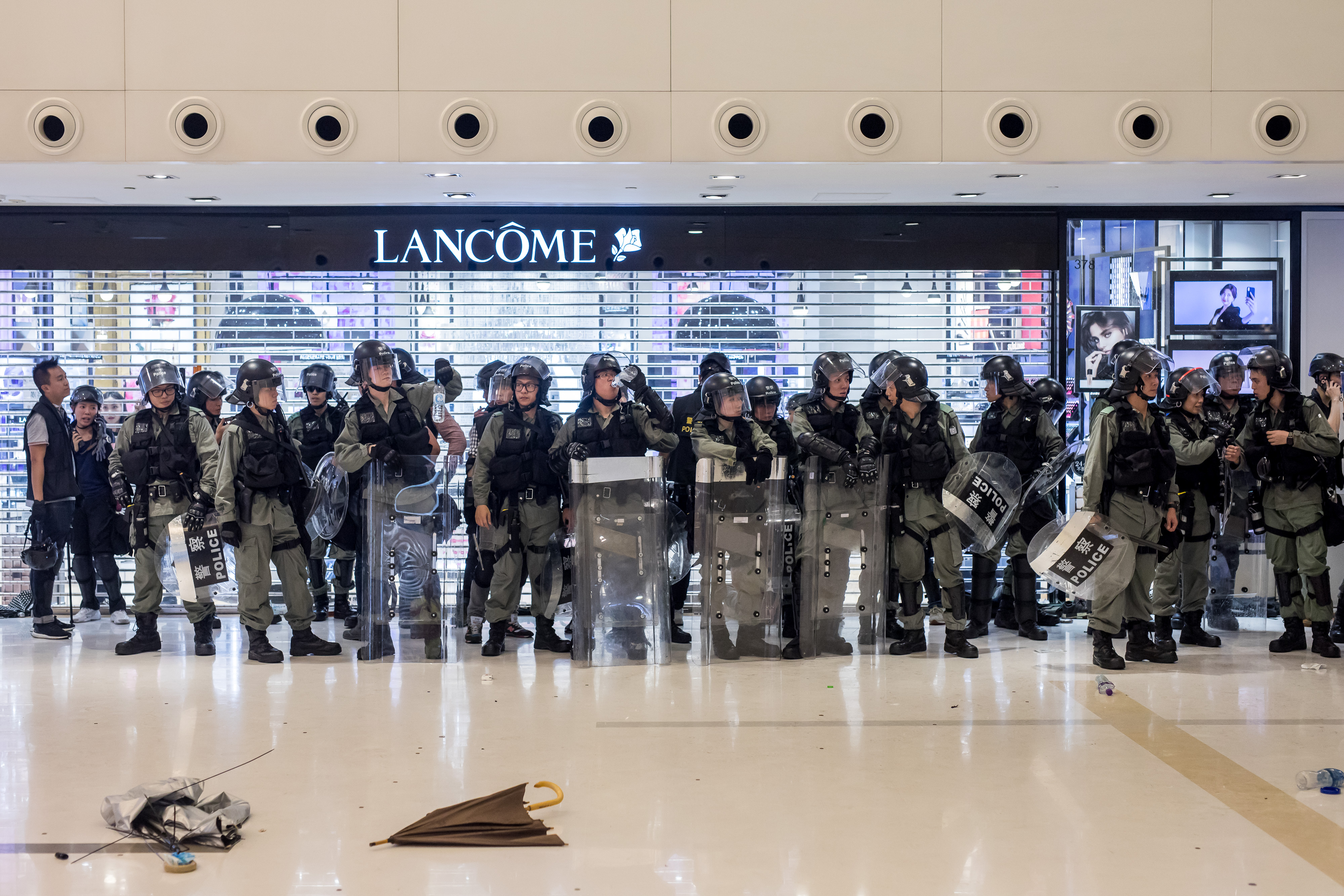 Riot police stand off against demonstrators inside New Town Plaza shopping mall, operated by Sun Hung Kai Properties Ltd., during a protest in the Shatin district of Hong Kong, China, on Sunday, July 14, 2019. (Paul Yeung/Bloomberg via Getty Images)