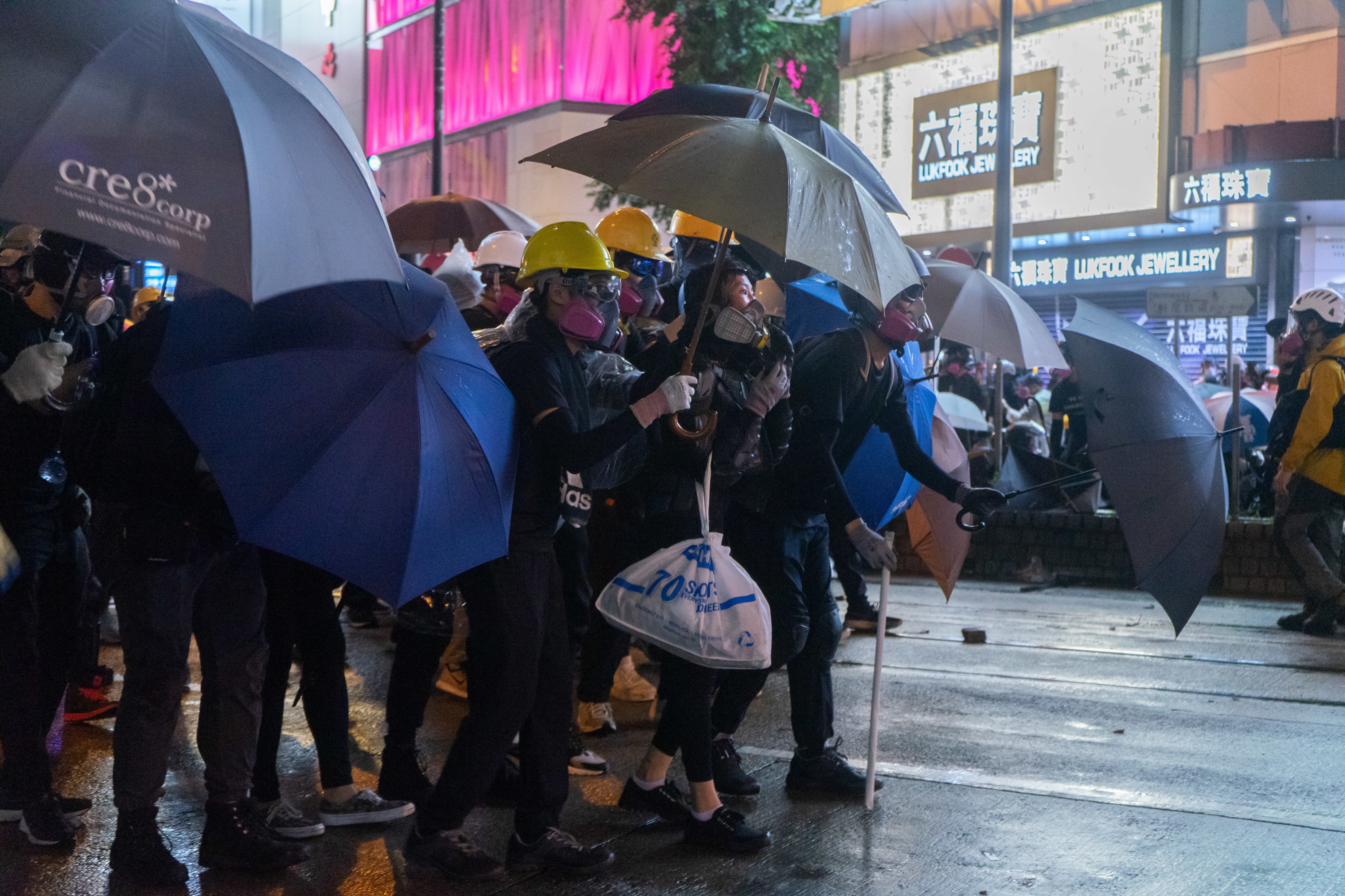 Protesters hold umbrellas to protect themselves from police attack in Hong Kong on Aug. 31, 2019. (Alda Tsang/SOPA Images/LightRocket via Getty Images)