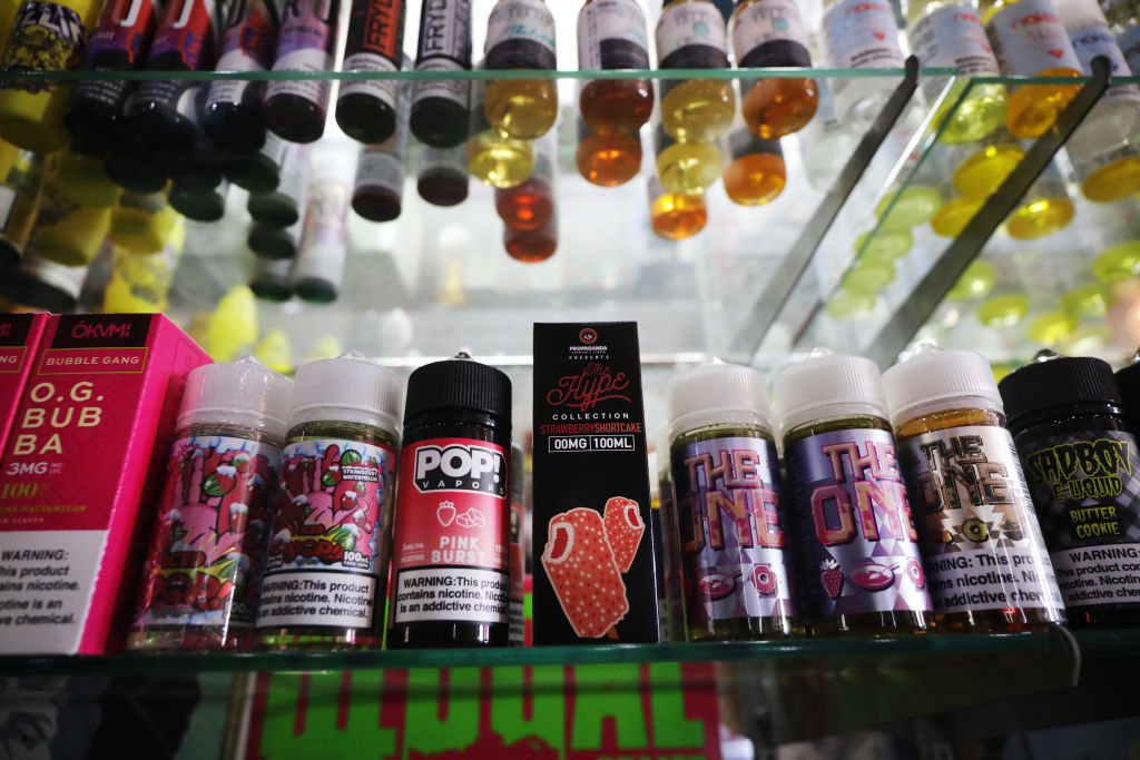 Vaping products, including flavored vape liquids and pods, are displayed at Gotham Vape in Queens, on September 17, 2019 in New York City. Michigan has joined New York in banning the sale of flavored e-cigarettes as federal health officials investigate the cause of hundreds of serious breathing illnesses in people who have used vaping devices. (Spencer Platt&mdash;Getty Images)