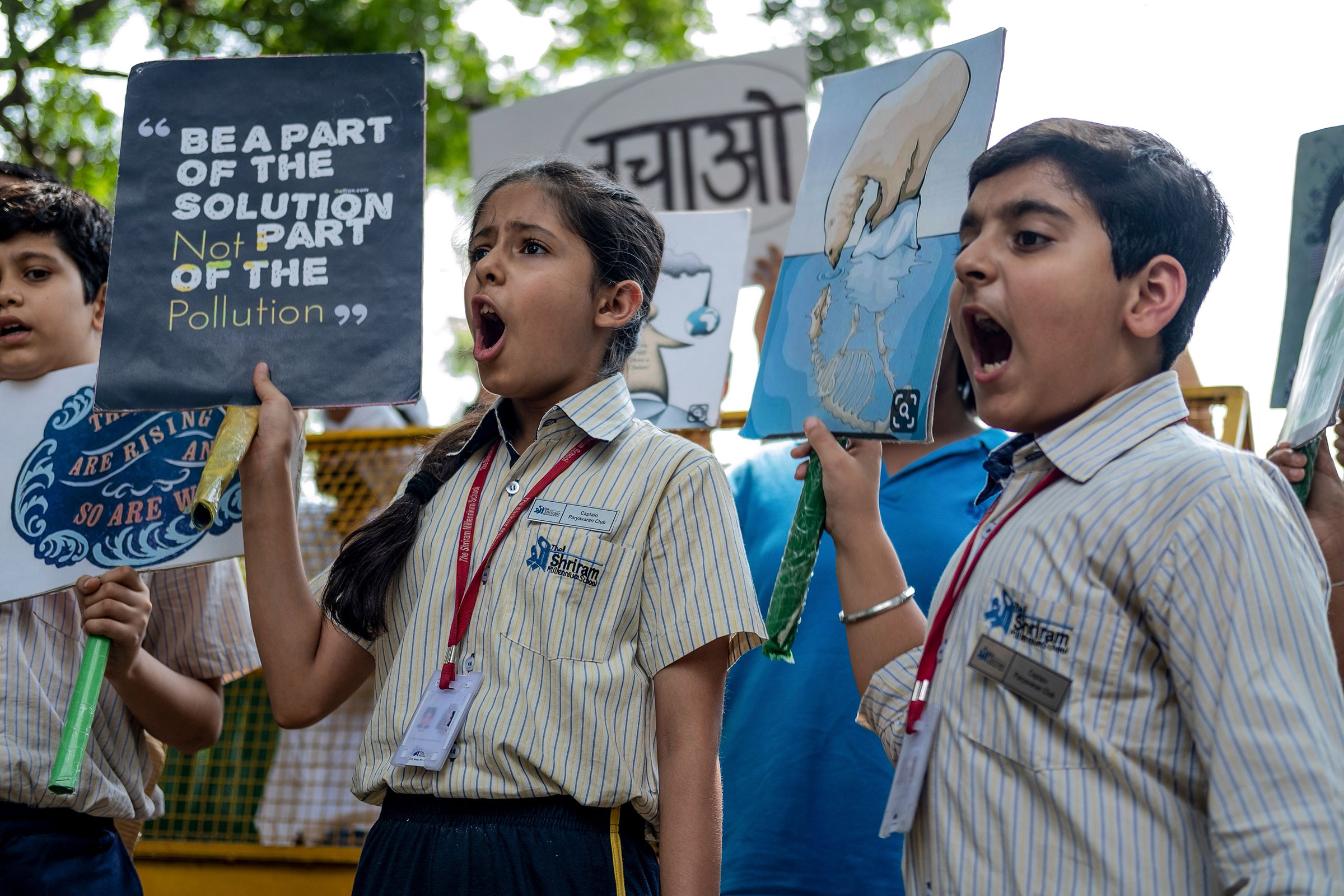 School children shout slogans as they participate in a climate strike to protest against governmental inaction towards climate breakdown and environmental pollution, part of demonstrations being held worldwide in a movement dubbed "Fridays for Future", in New Delhi on September 20, 2019. (Laurene Becquart—AFP/Getty Images)