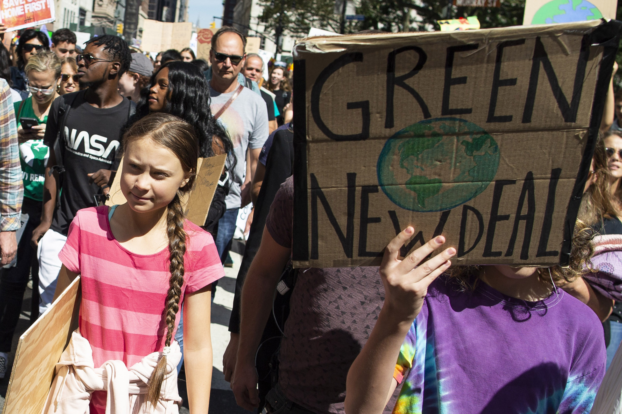 Swedish environmental activist Greta Thunberg, left, takes part during the Climate Strike, Friday, Sept. 20, 2019 in New York. (Eduardo Munoz Alvarez—AP)
