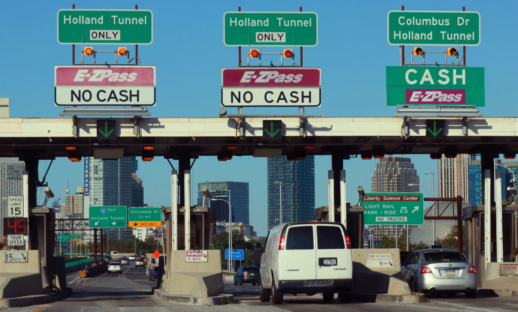 Cars pass through a toll plaza on the New Jersey Turnpike on August 29, 2019 in Jersey City, New Jersey.  Unless the federal government starts making major investments, the dire infrastructure needs of our nation will only get worse, says Reps. Nita M. Lowey and David E. Price. (Gary Hershorn&mdash;Corbis via Getty Images)