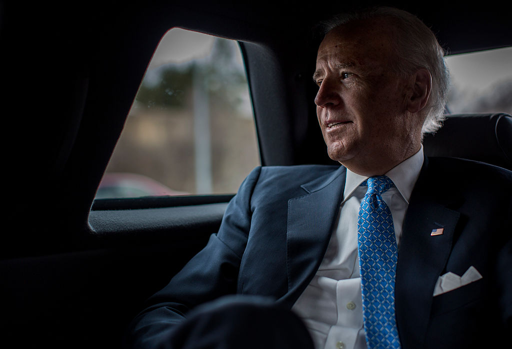 Contemplatively looks out the car window during a planning meeting with staff, Vice President Joe Biden is driven back to the White House after speaking to lawmakers, woman against violence advocates, and constituents concerning reducing domestic violence homicides in Rockville, Md., on March 13, 2013. (The Washington Post—The Washington Post/Getty Images)