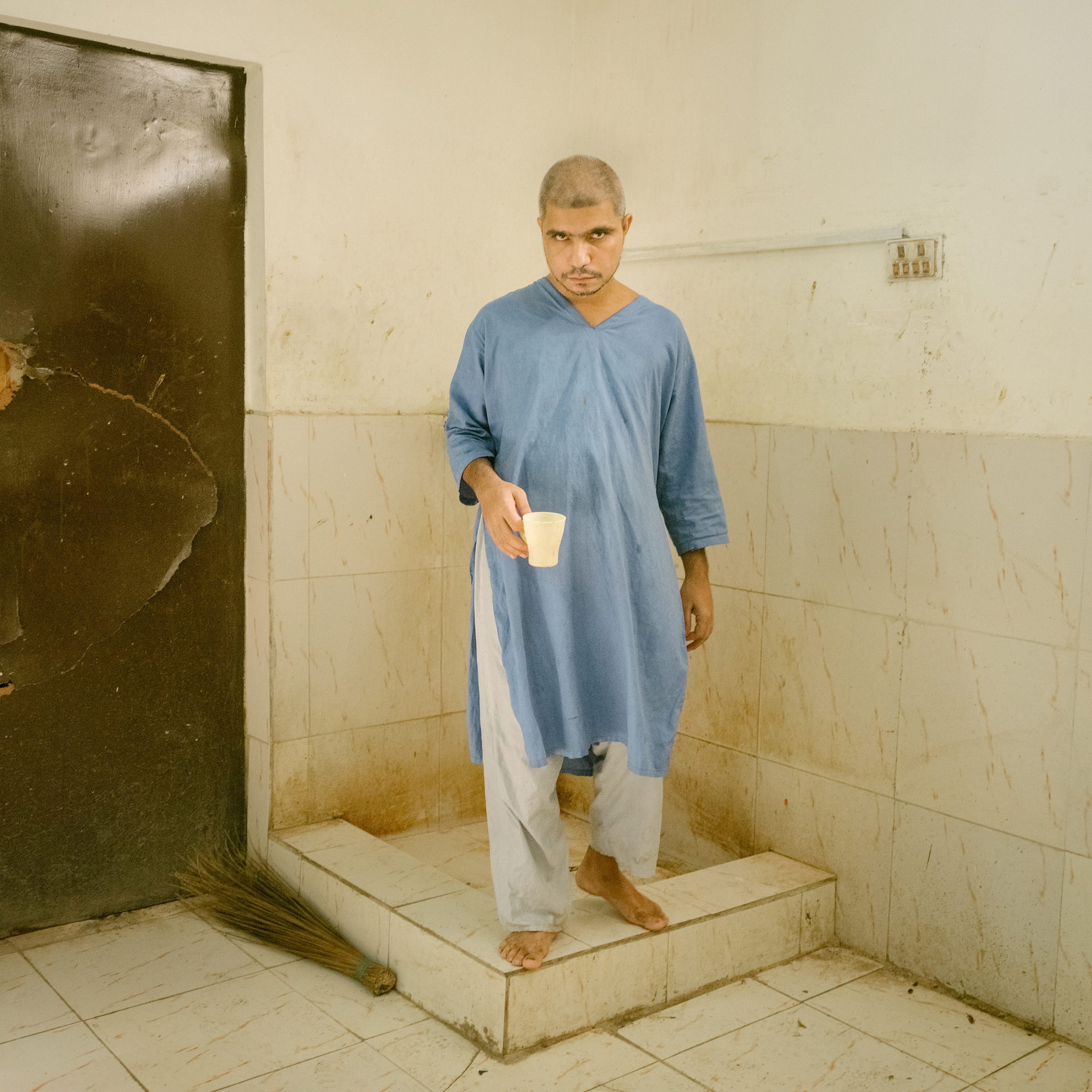 A patient retrieves water at a mental asylum in Hyderabad, south of Jacobabad, on July 2. (Matthieu Paley for TIME)