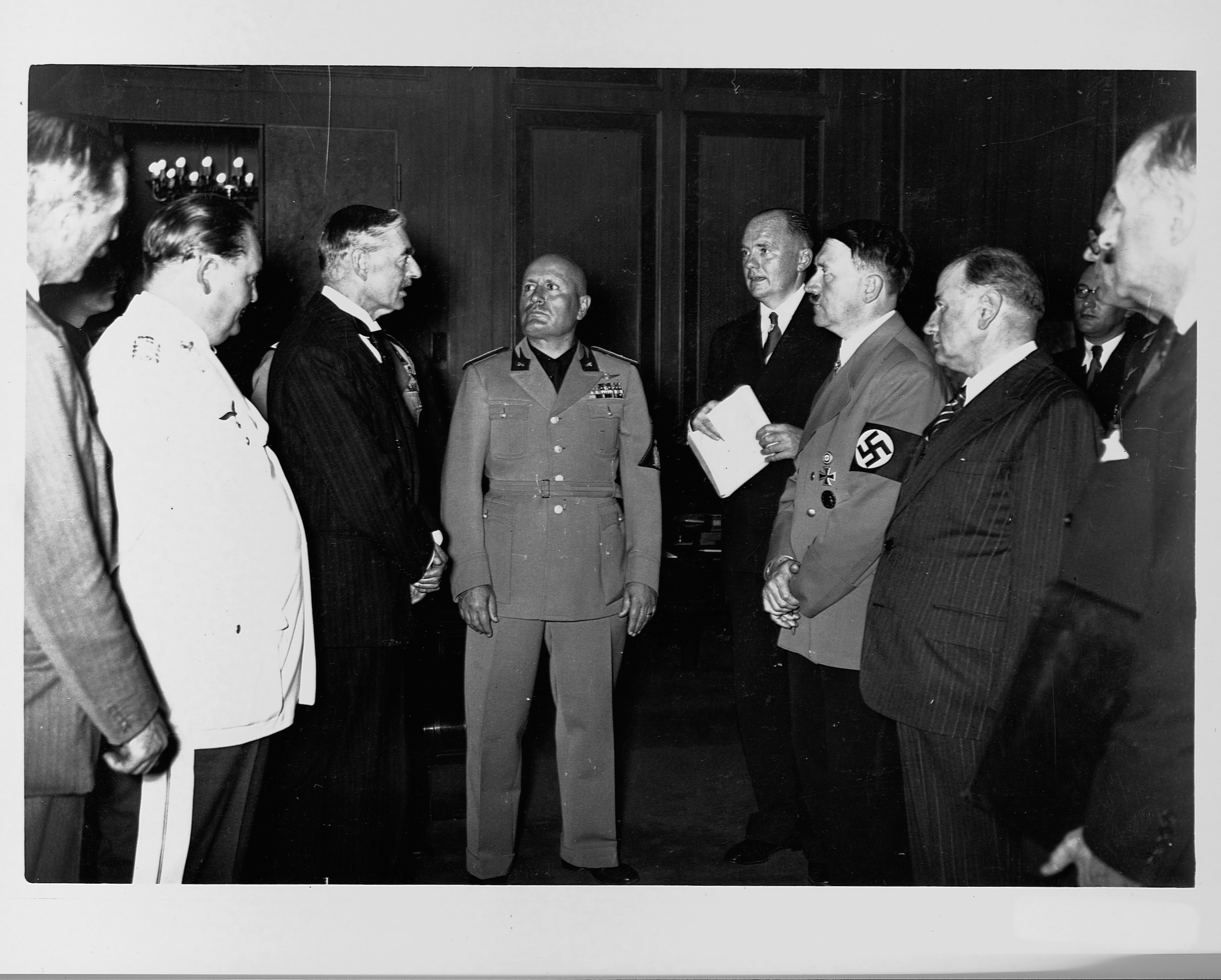 Neville Chamberlain, Adolph Hitler, Benito Mussolini, and Hermann Goering stand together at the Munich Conference in 1938. (Library of Congress—Corbis/VCG via Getty Images)
