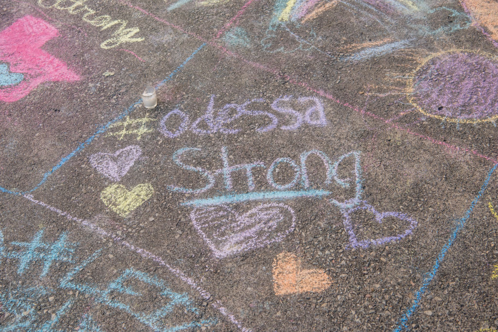 A chalk message at a memorial for victims of a mass shooting, at the University of Texas of the Permian Basin (UTPB) on Sept. 2, 2019 in Odessa, Texas. (Cengiz Yar&mdash;Getty Images)