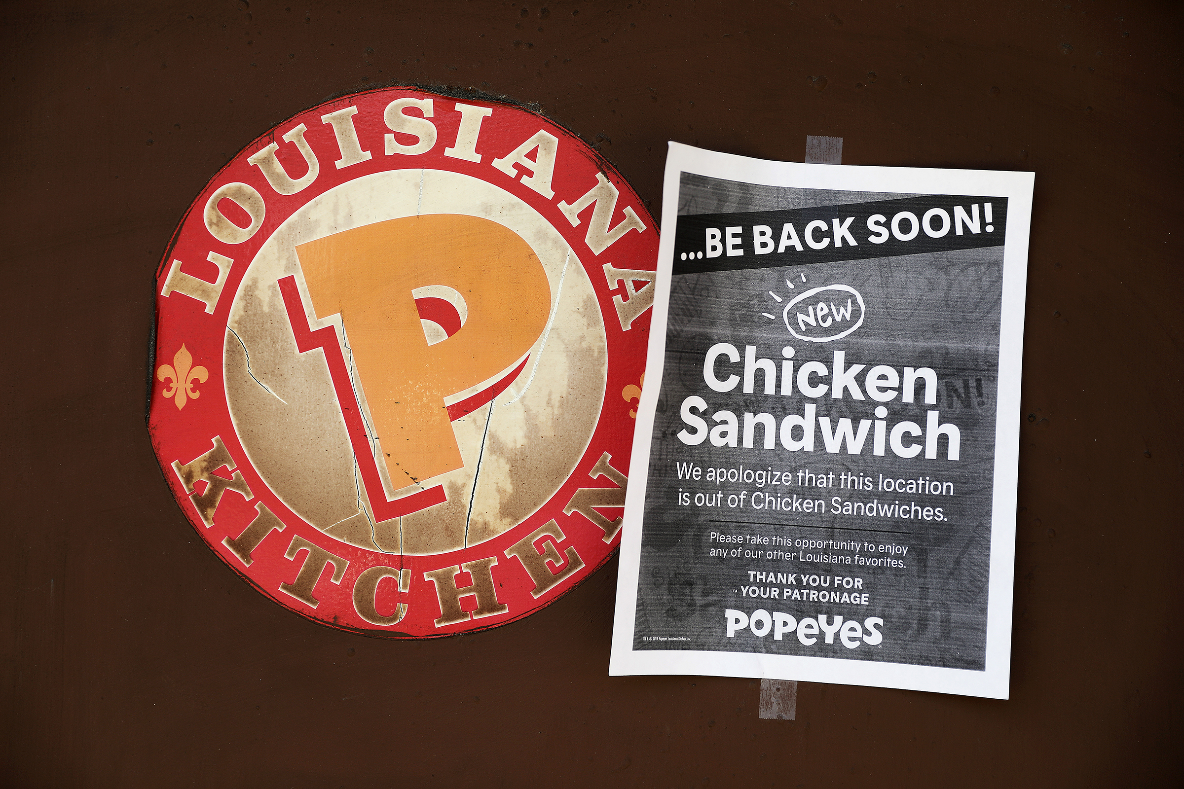 A sign indicating that chicken sandwiches are sold out hangs at the Popeyes location on Brookline Avenue near Fenway Park in Boston on Aug. 26, 2019. (Pat Greenhouse—The Boston Globe via Getty Images)