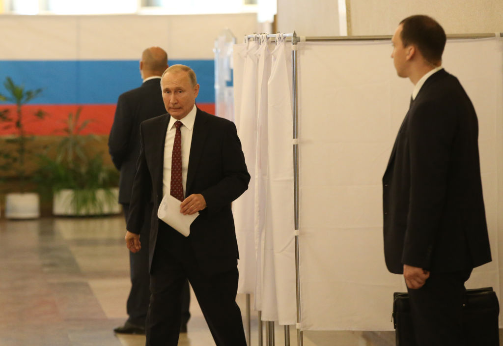 Russian President Vladimir Putin votes at the polling station in Moscow